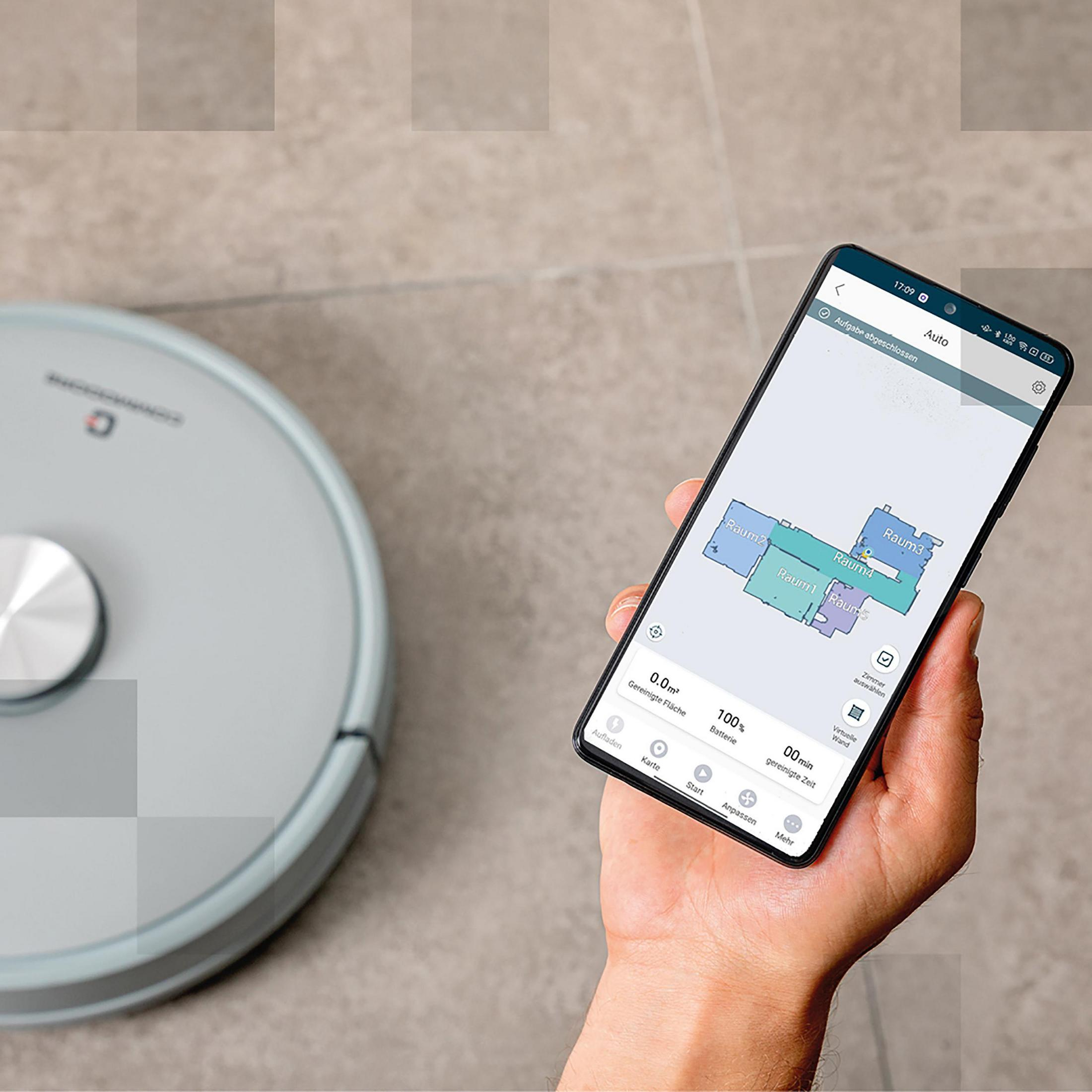 Roboterstaubsauger und Telefon. Das Telefon zeigt eine Karte des Raumes. Der Staubsauger steht im Hintergrund auf dem Boden.