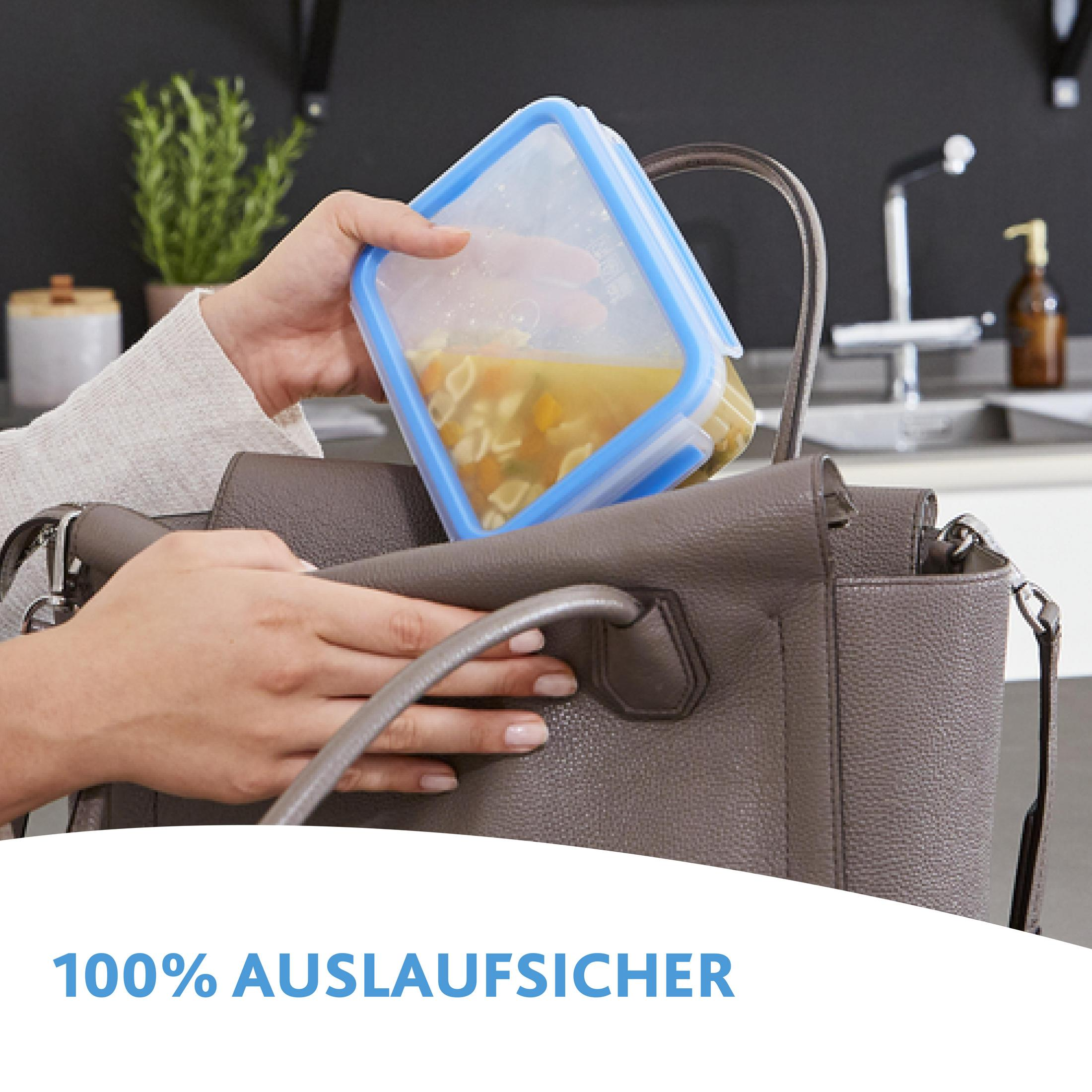 Hand legt suppengefüllten Behälter in graue Handtasche. Text: 100% AUSLAUFSICHER.