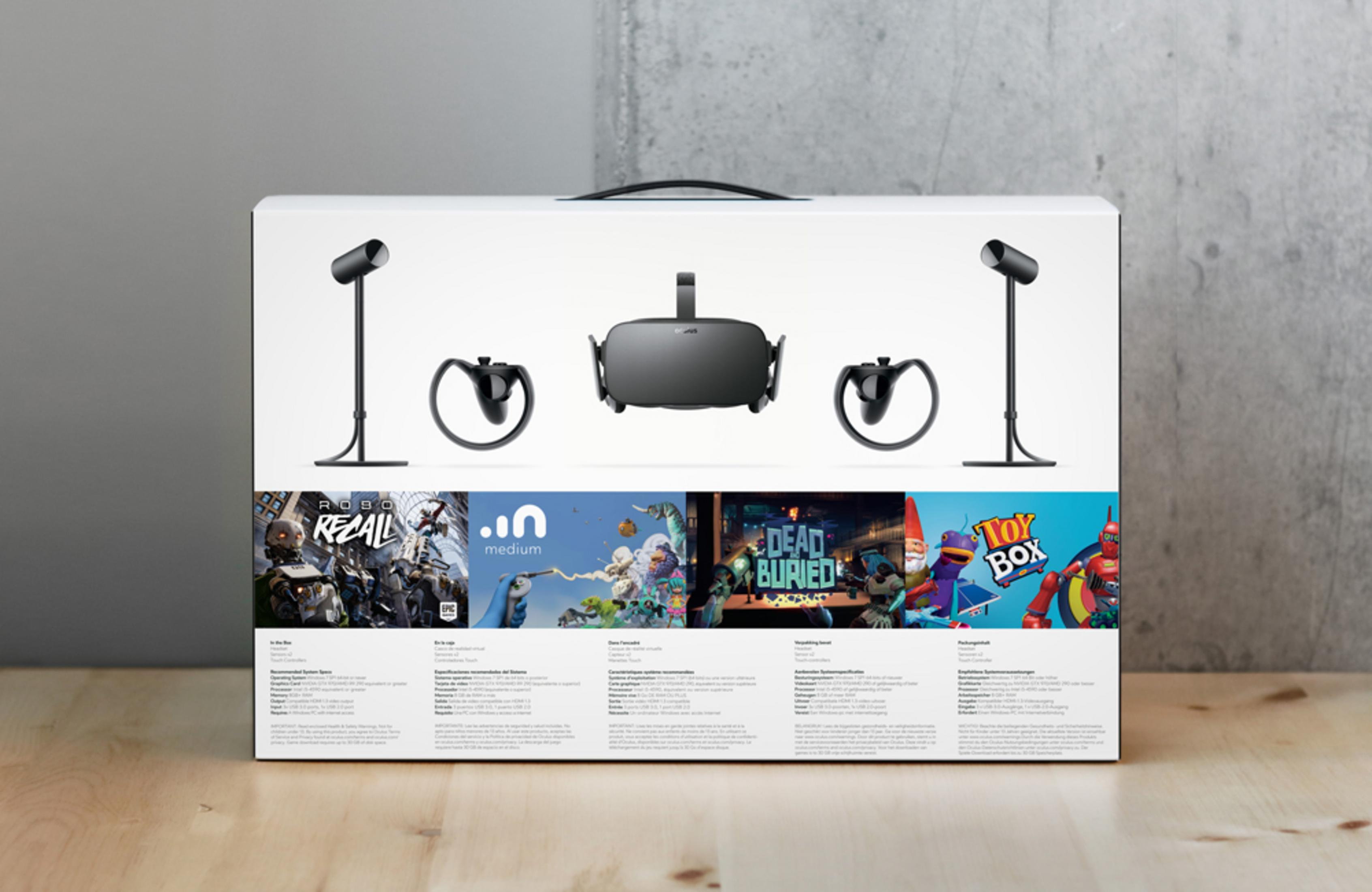 Oculus VR-Headset-Box. Zeigt Headset, Controller und Spiele. Weißer Hintergrund.