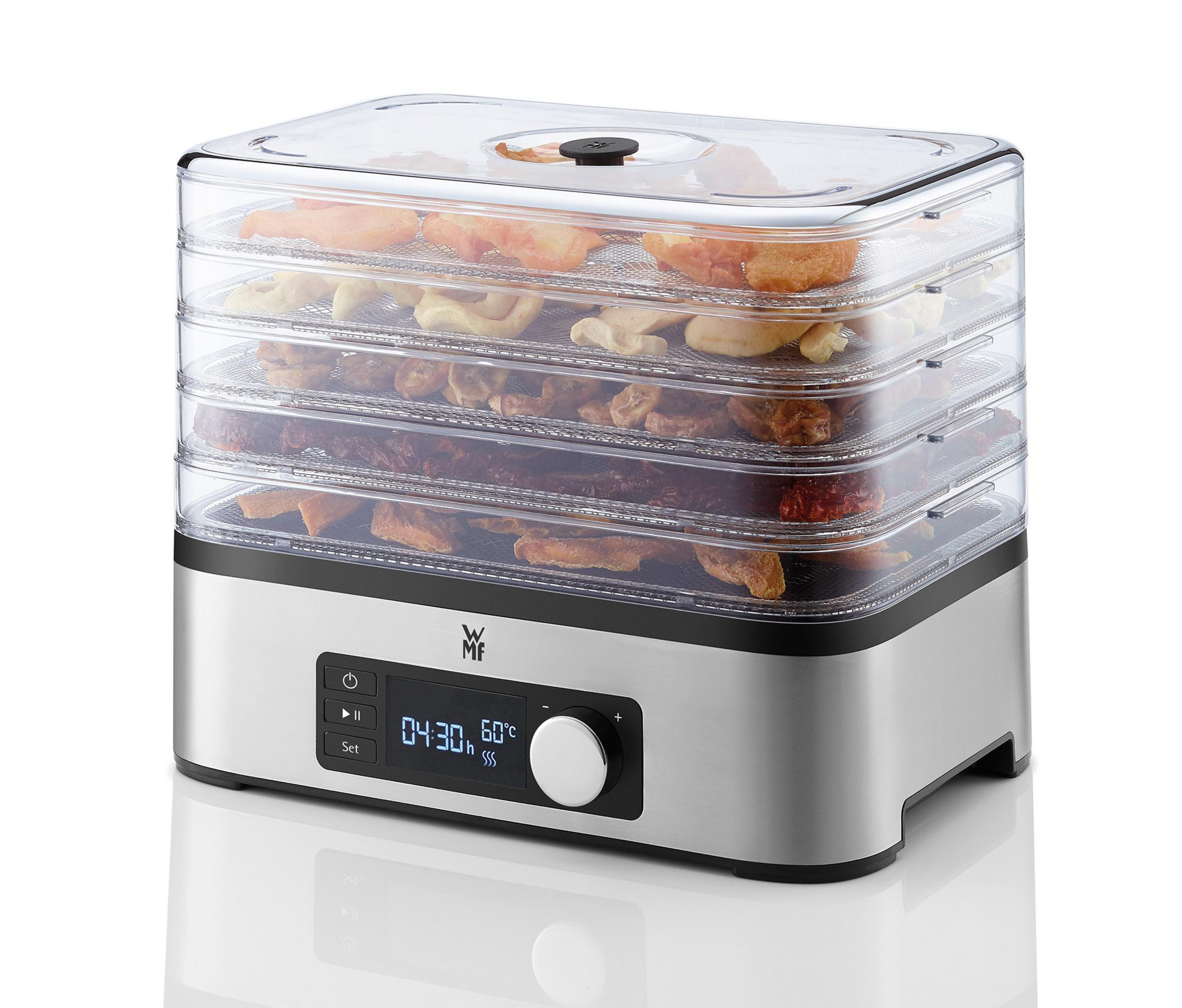 Suszarka do żywności z wieloma tacami suszonych owoców. Wyświetlacz i pokrętło z przodu.