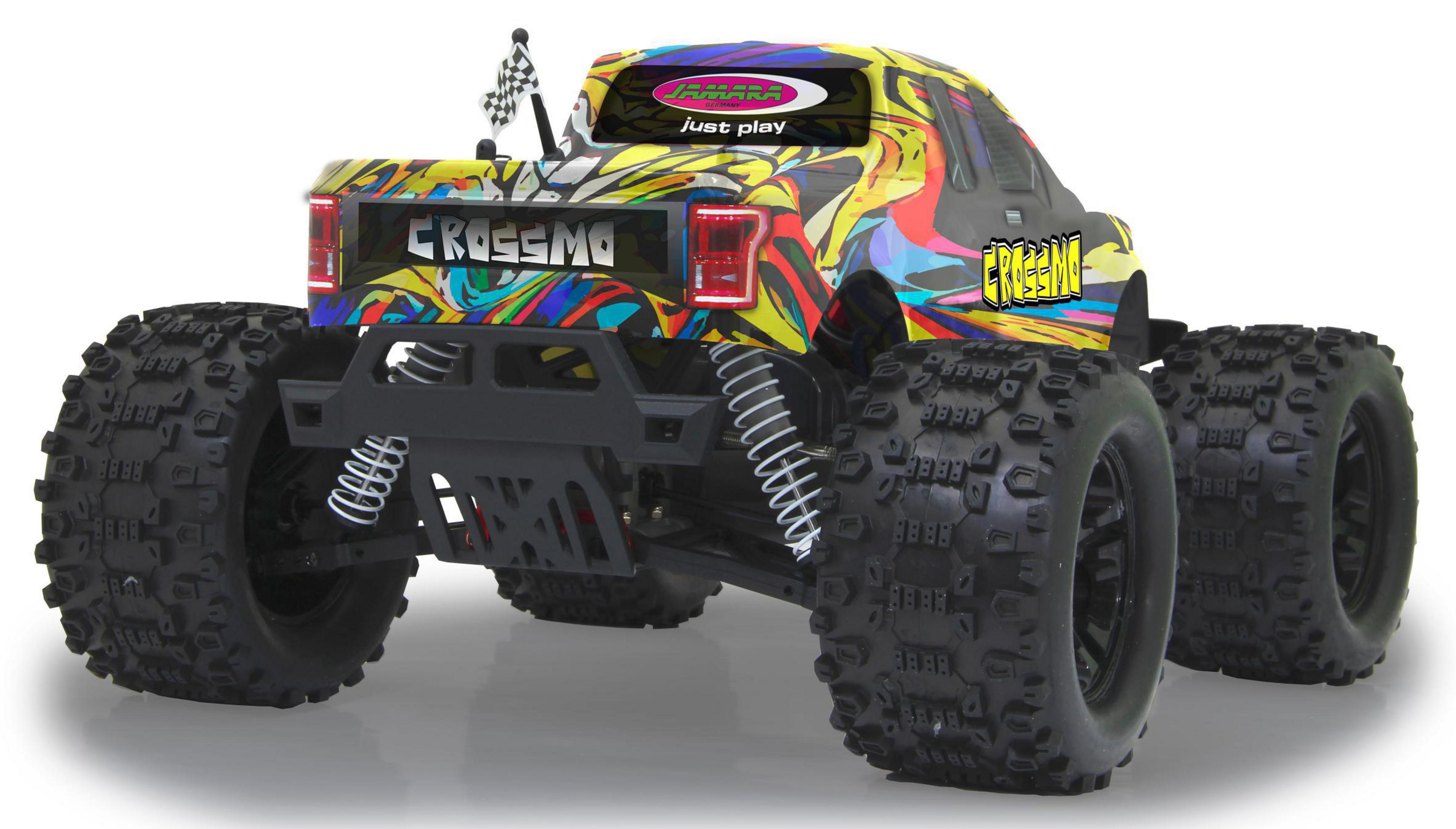 Eine Rückansicht eines mit Graffiti bedeckten Monstertrucks.