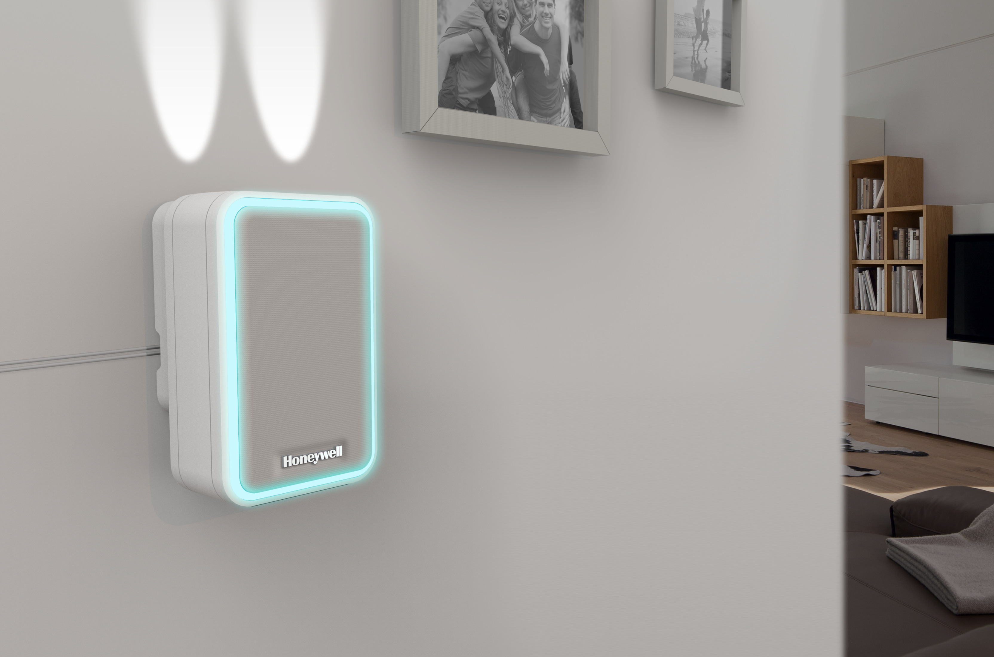 Ein weißes Gerät mit blauem Licht an einer Wand. Im Hintergrund befinden sich Bilder und ein Fernseher.