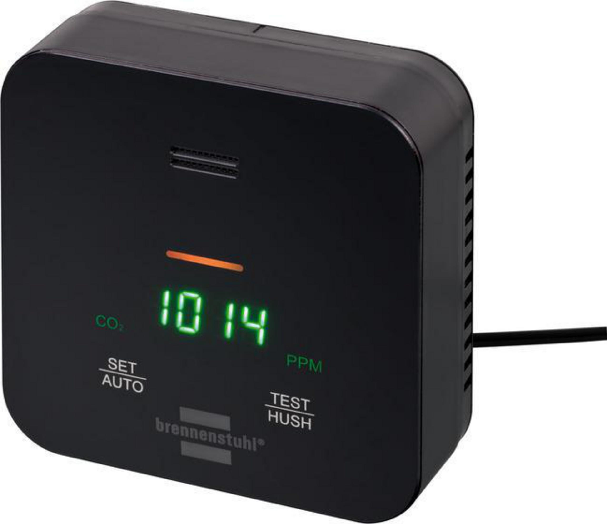 Czarny czujnik CO2 z wyświetlaczem cyfrowym pokazującym 1014 PPM. Przyciski: Set, Auto, Test i Hush.