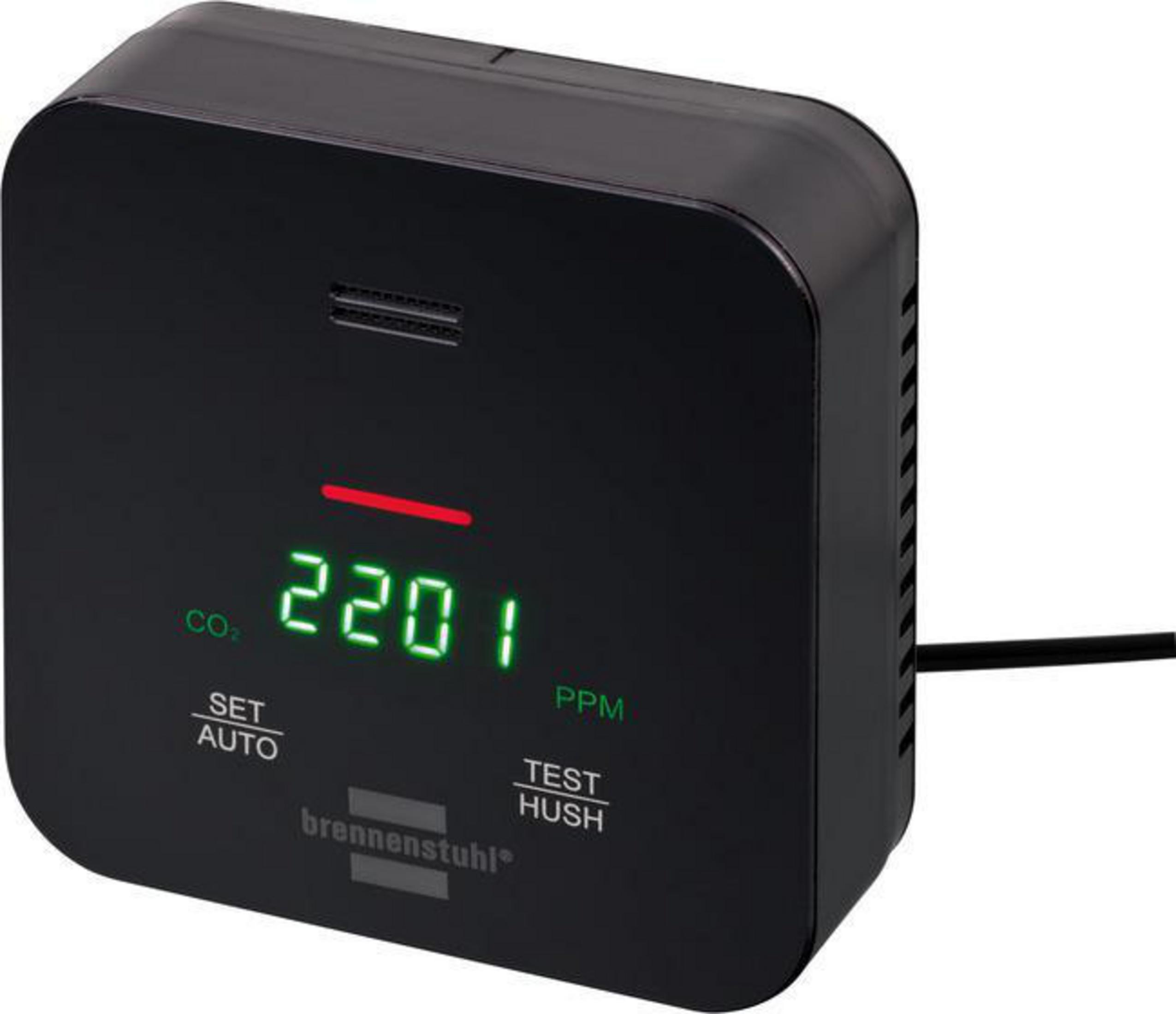 Czarny monitor CO2 wyświetla 2201 PPM. Posiada przyciski do ustawiania, auto, testu i wyciszenia.