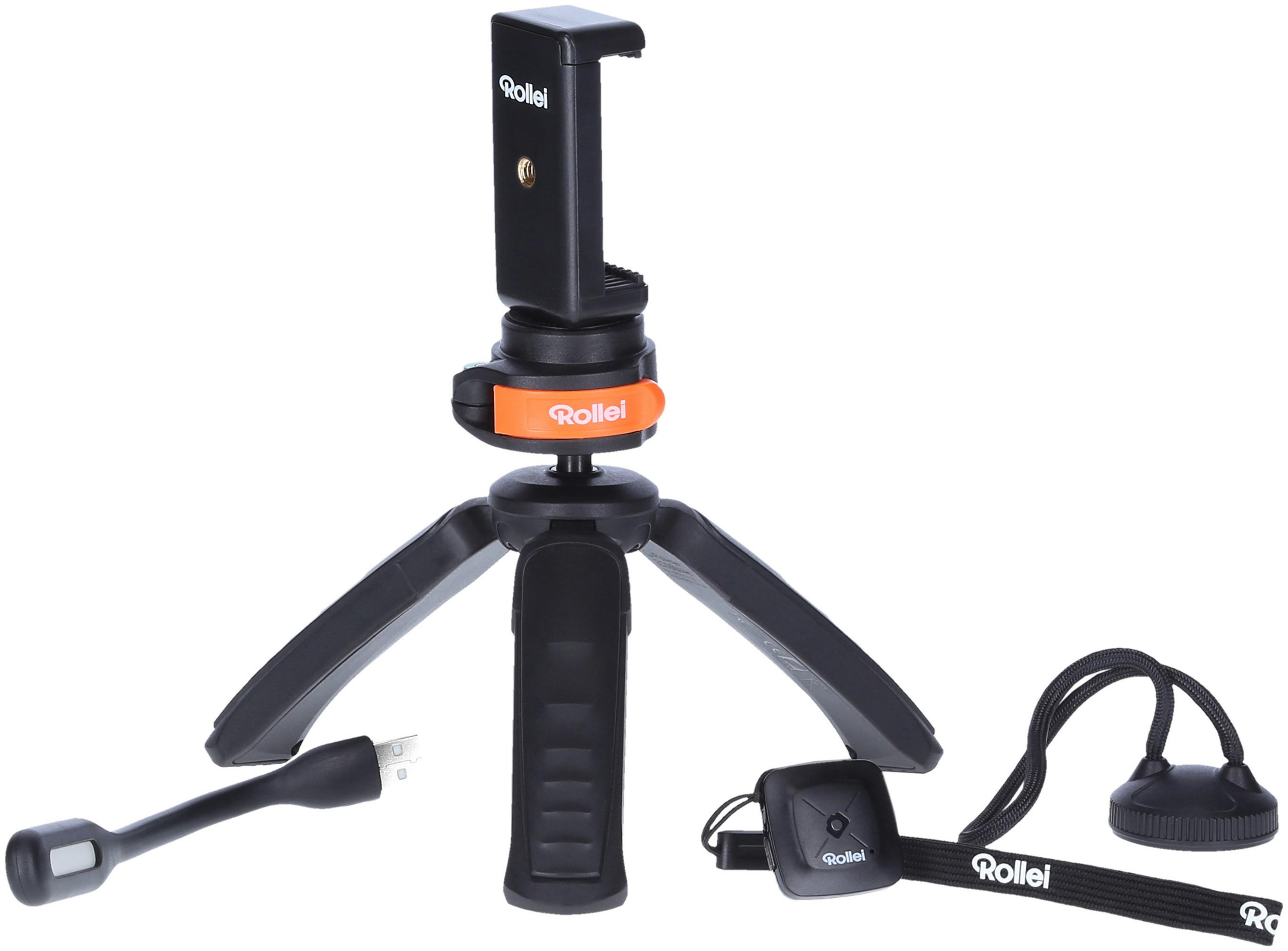 Black tripod with a phone holder, a USB cable, a remote and a wrist strap.