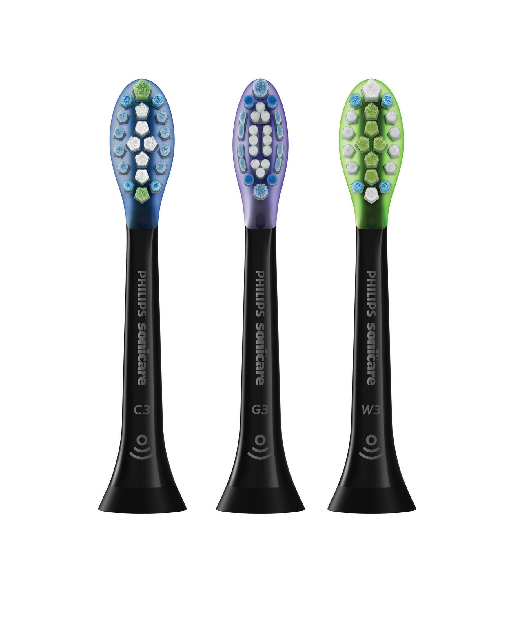 Trzy głowice Philips Sonicare z włosiem w różnych kolorach, czarne trzonki.