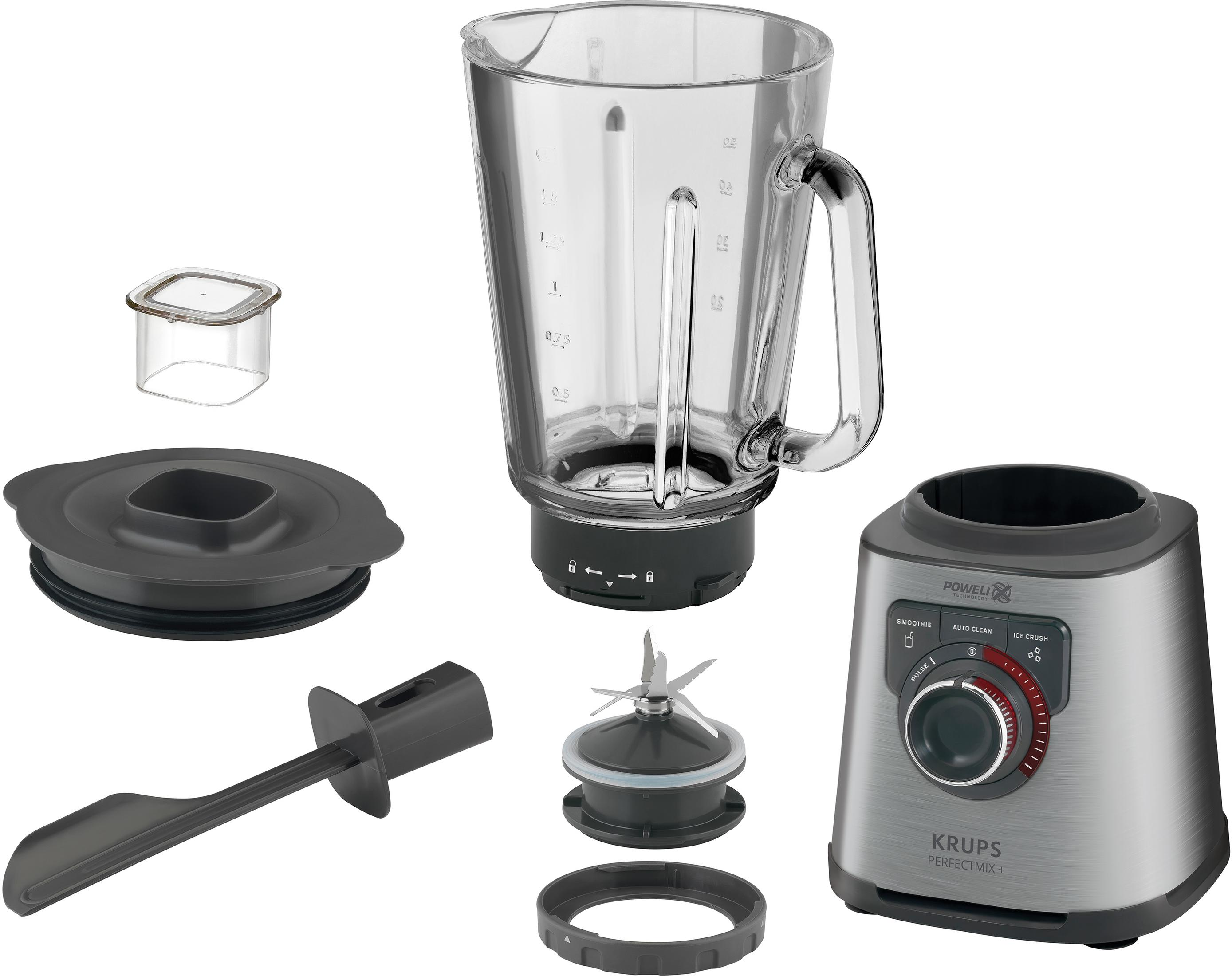 Ein zerlegter Mixer mit allen Teilen auf einer weißen Oberfläche. Der Mixer hat einen silbernen Sockel.