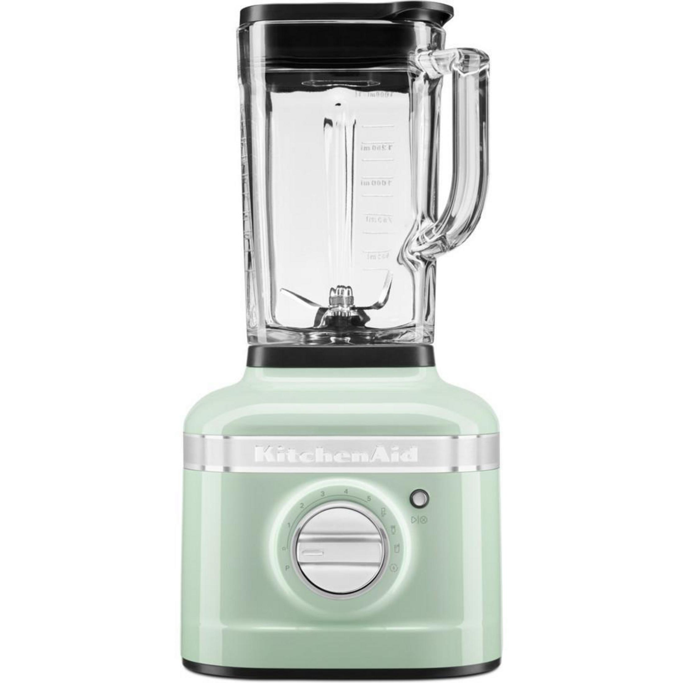 Mint green KitchenAid blender with black top and clear pitcher.