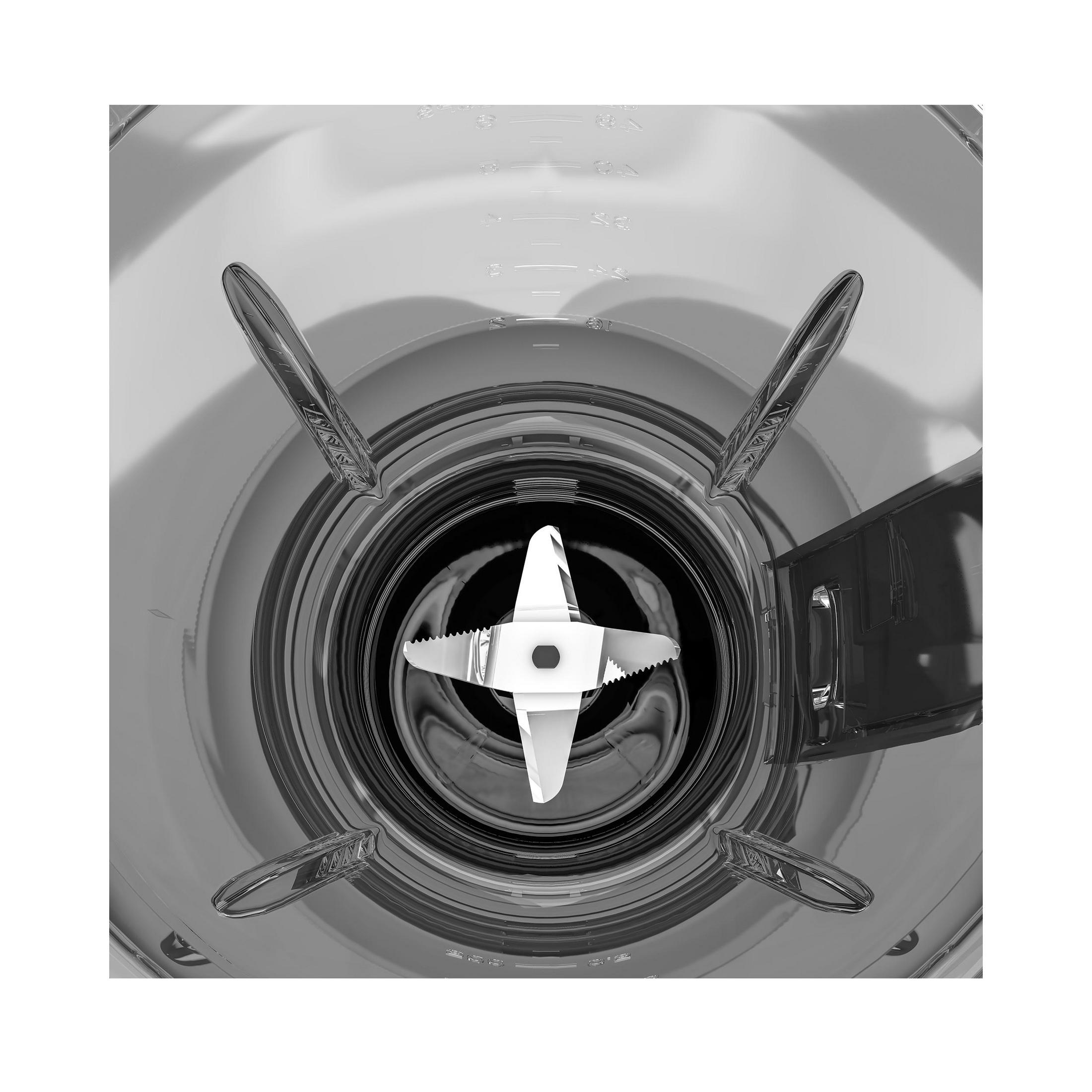 Wnętrze blendera, pokazujące ostrza, z przezroczystym pojemnikiem i białym tłem.