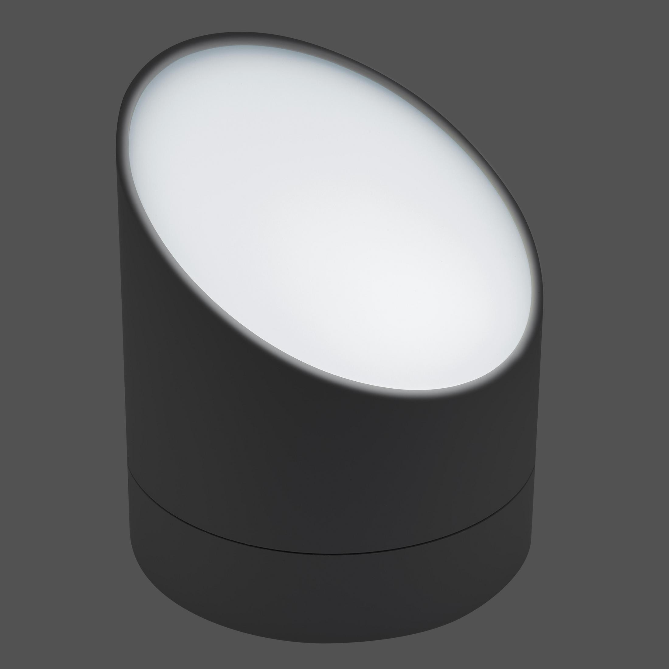 Luminaire cylindrique gris avec dessus blanc éclairé. Sur fond gris.