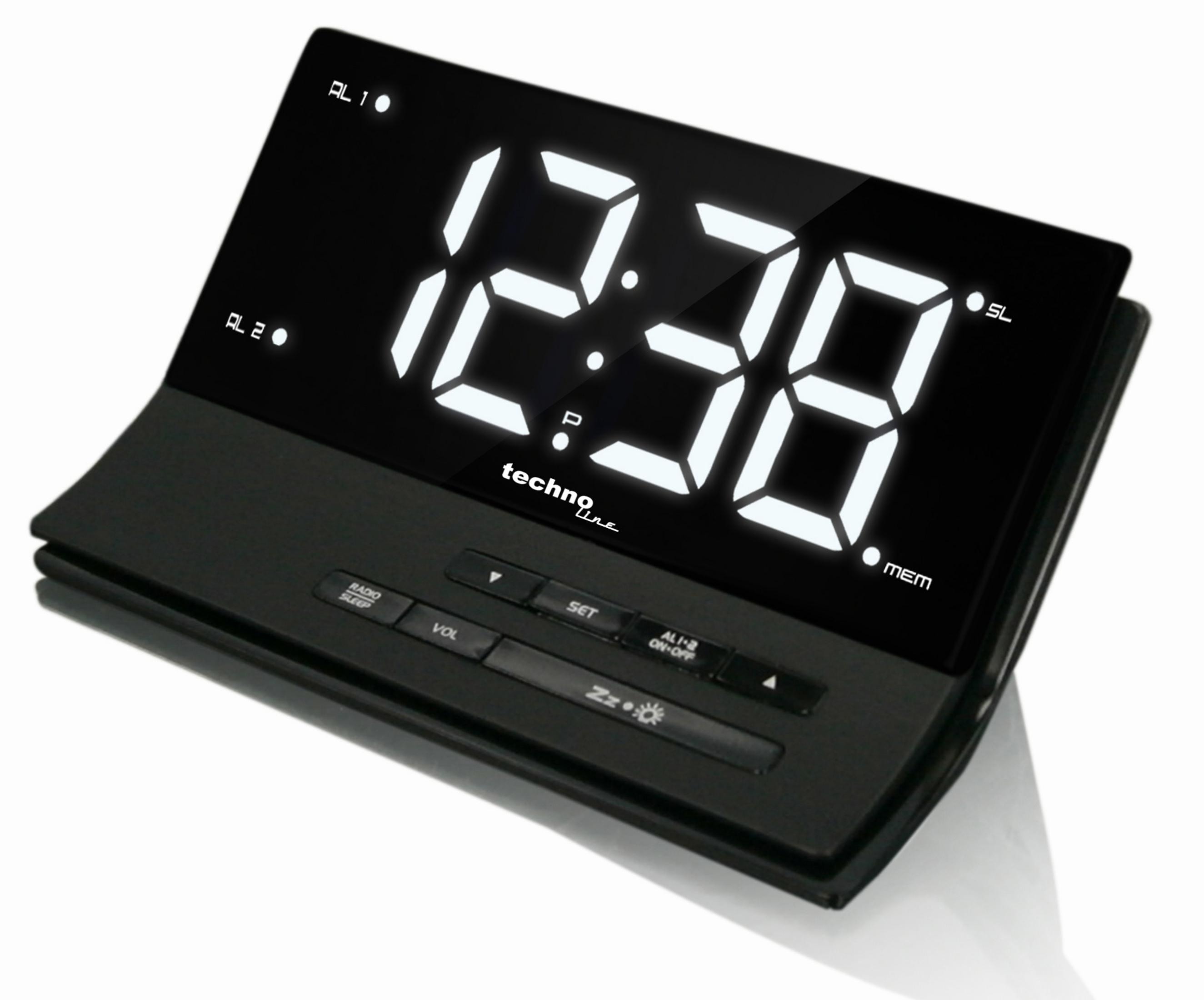 Schwarze Digitaluhr mit der Anzeige 12:38. Hat Tasten für Radio, Set und Schlummerfunktion.