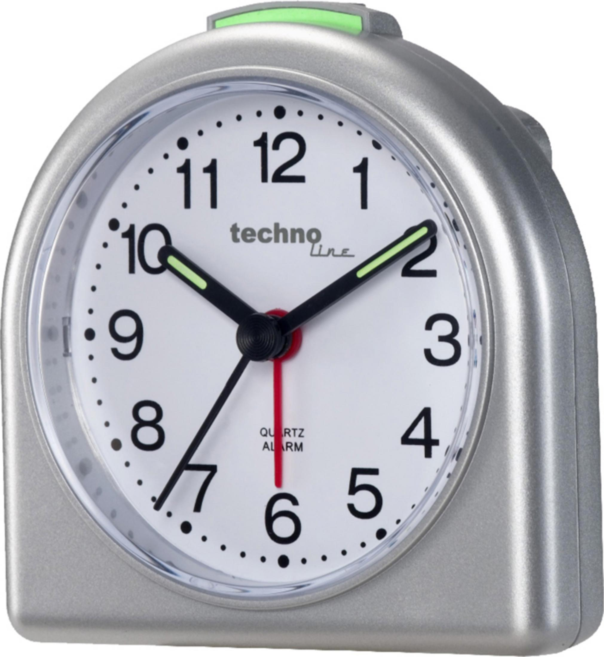 Ein silberner Wecker mit weißem Zifferblatt und schwarzen Zahlen und Zeigern. Er trägt die Aufschrift "techno line".