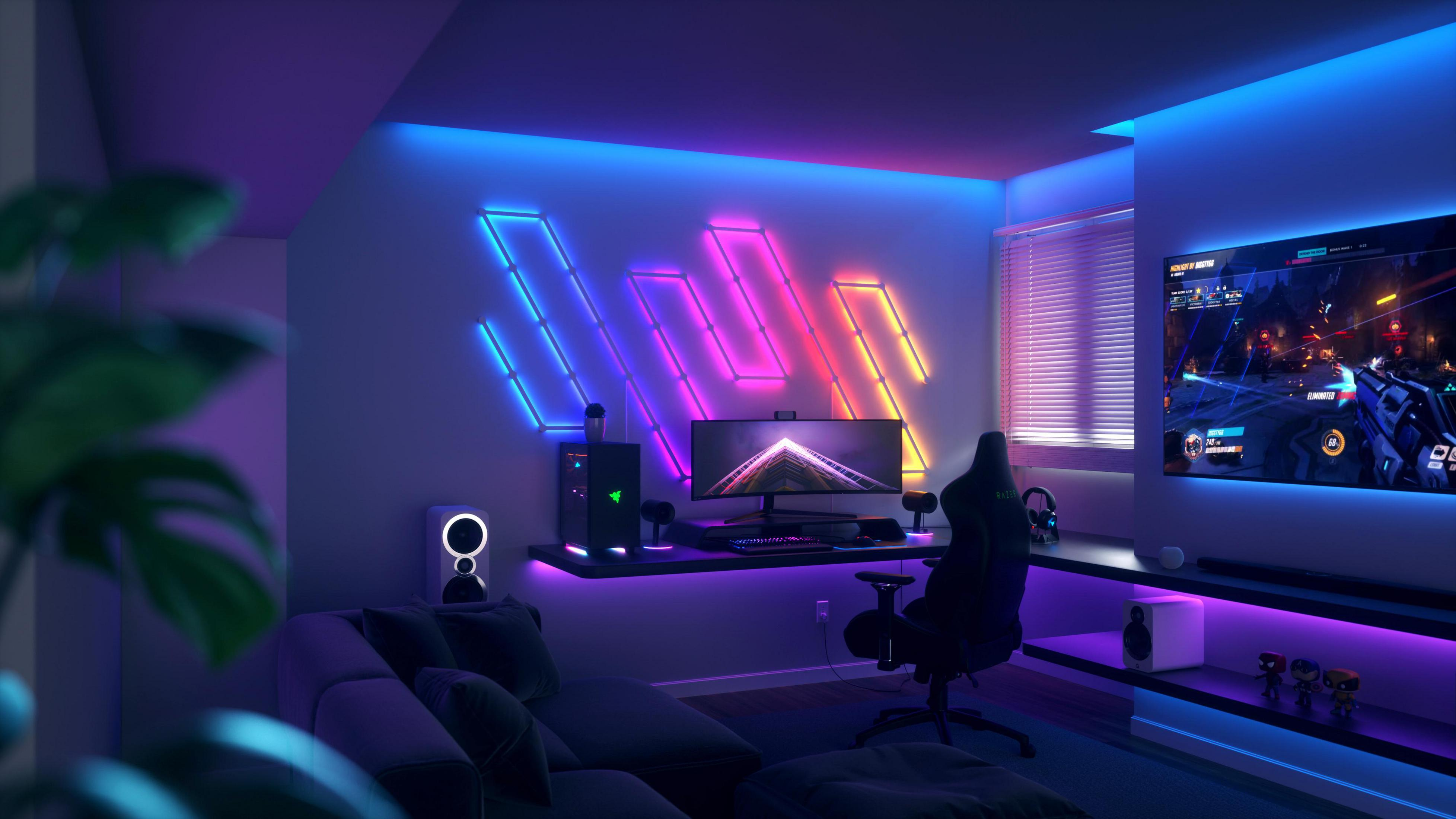 Stanza giochi con luci al neon, configurazione computer, divano e TV che mostra un gioco.