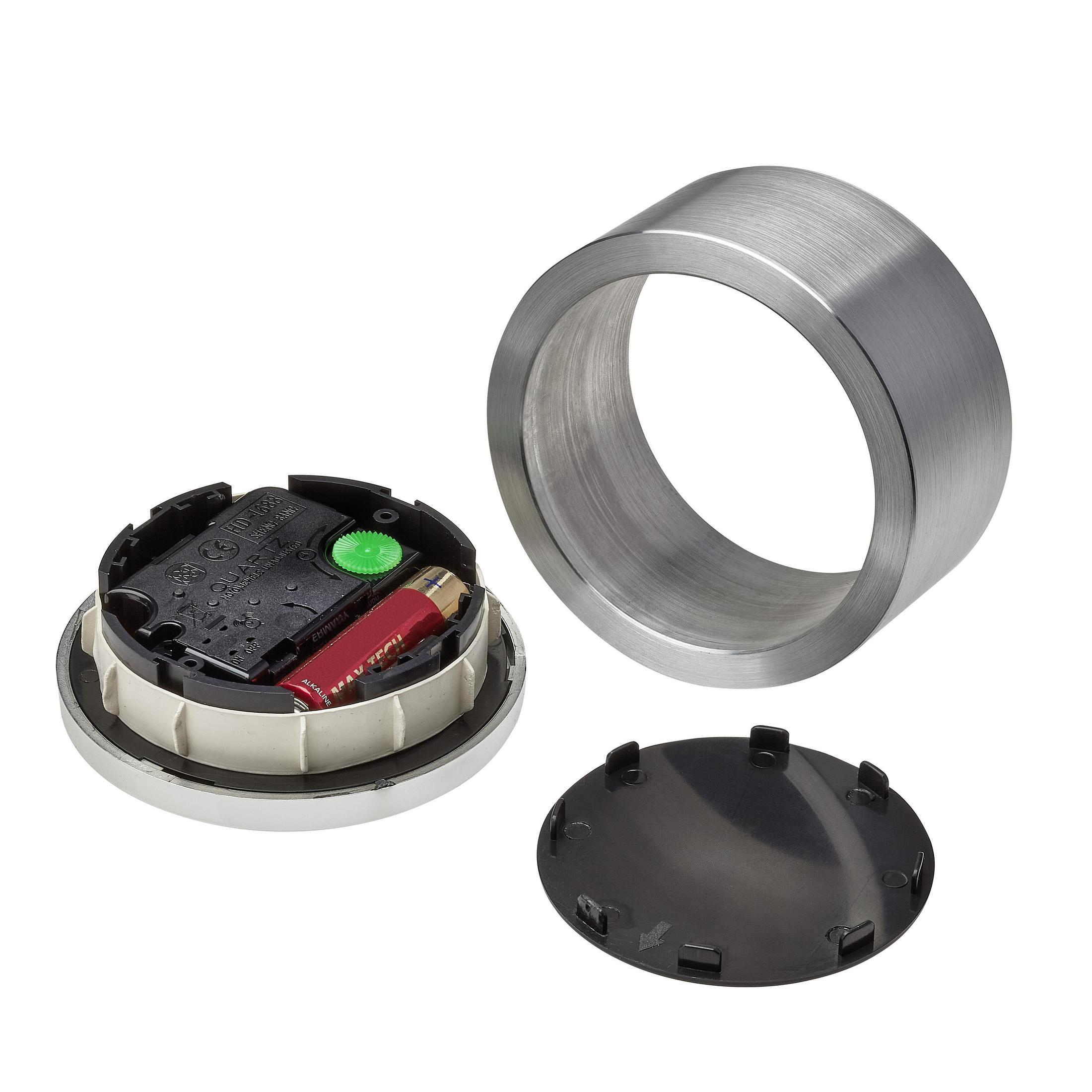 Meccanismo dell'orologio con batteria, anello metallico e coperchio nero.