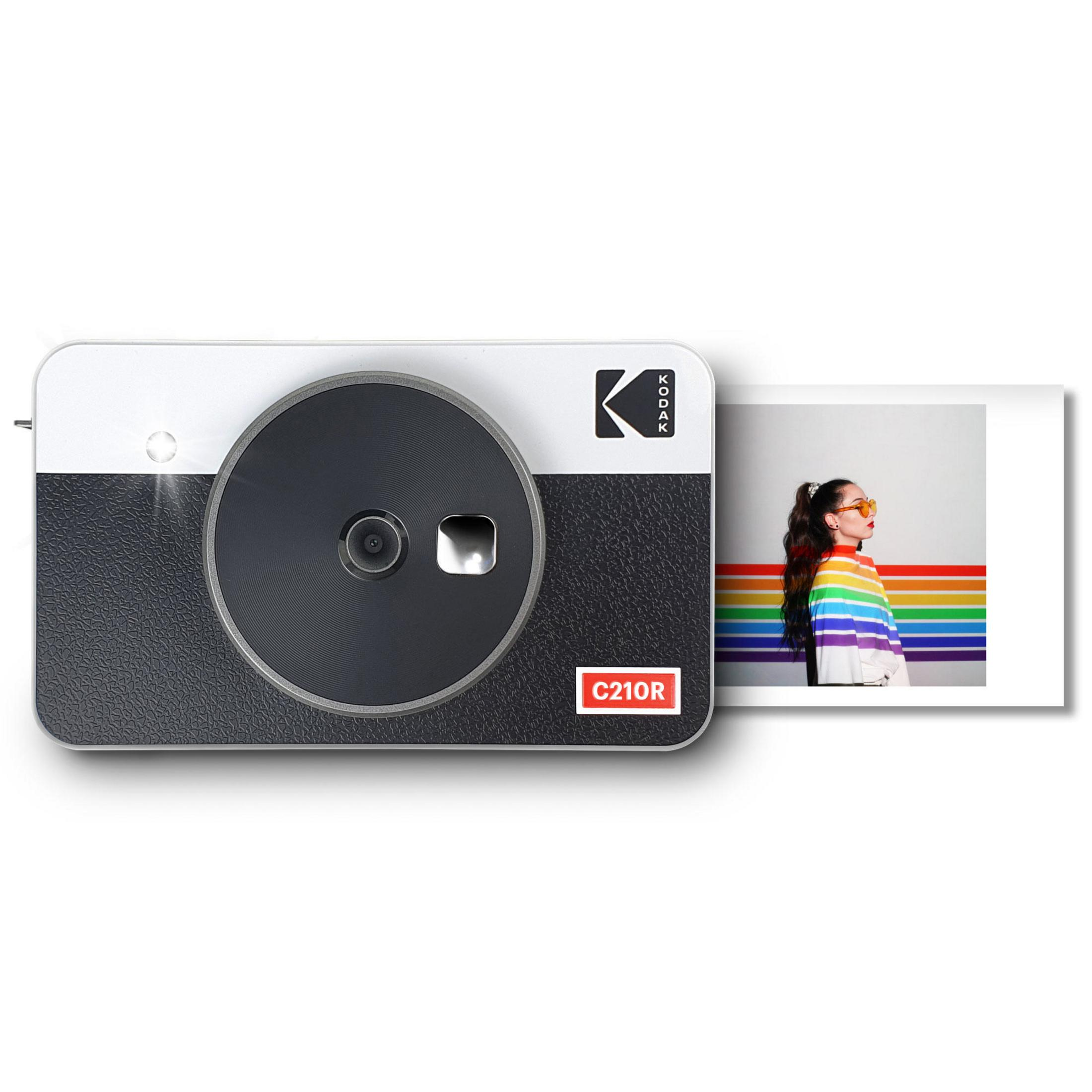 Kodak C210R Kamera, schwarz und weiß, mit einem Foto einer Person vor einem Regenbogenhintergrund.