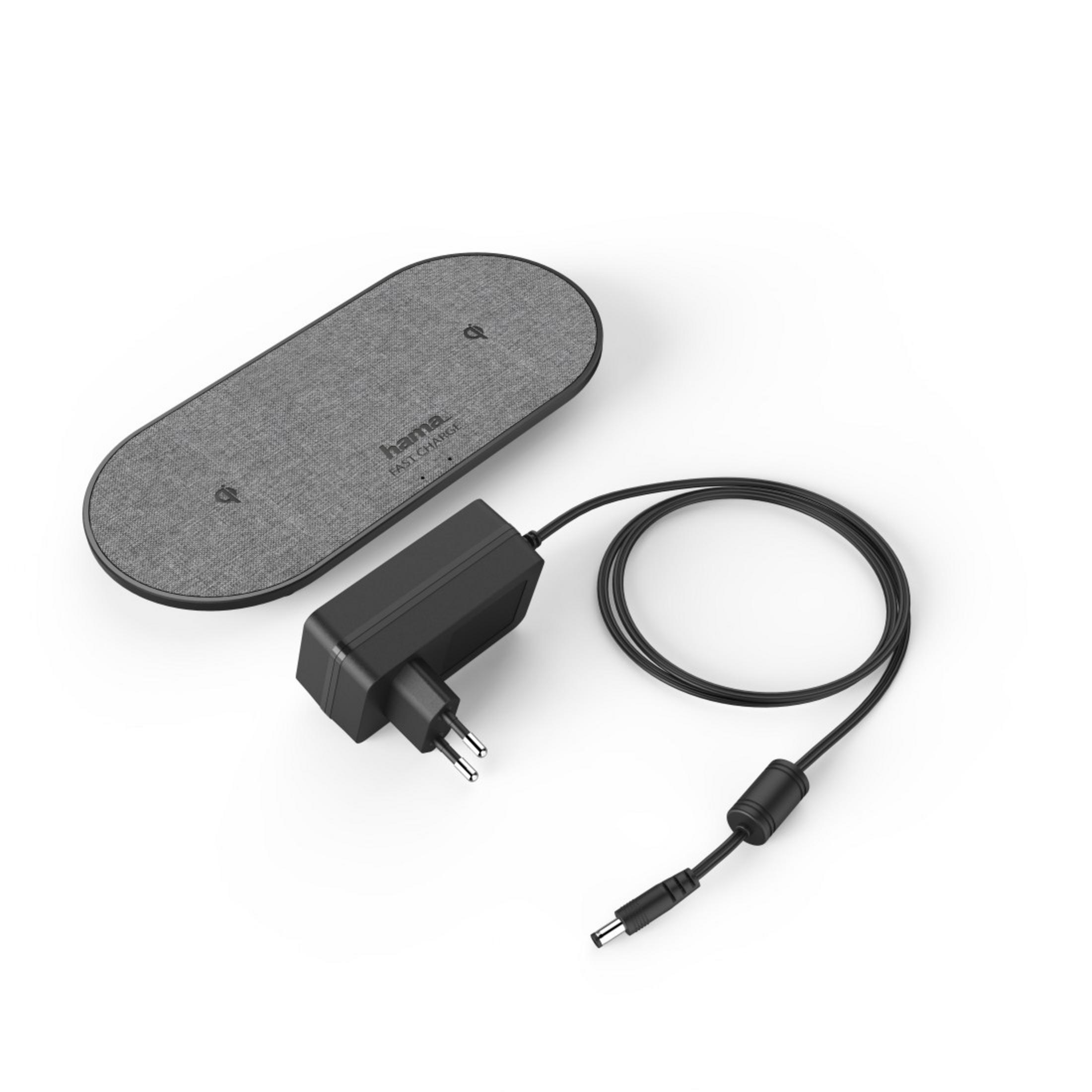 Kabelloses Ladegerät und Netzteil. Graues Ladegerät, schwarzer Adapter und Kabel. Weißer Hintergrund.