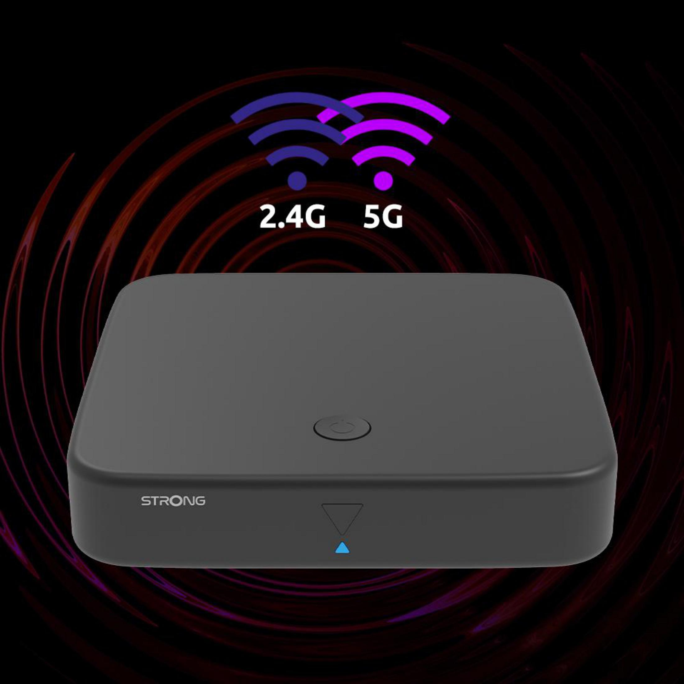 Un dispositivo cuadrado negro con un botón de encendido, señales inalámbricas de 2.4G y 5G y la palabra STRONG.