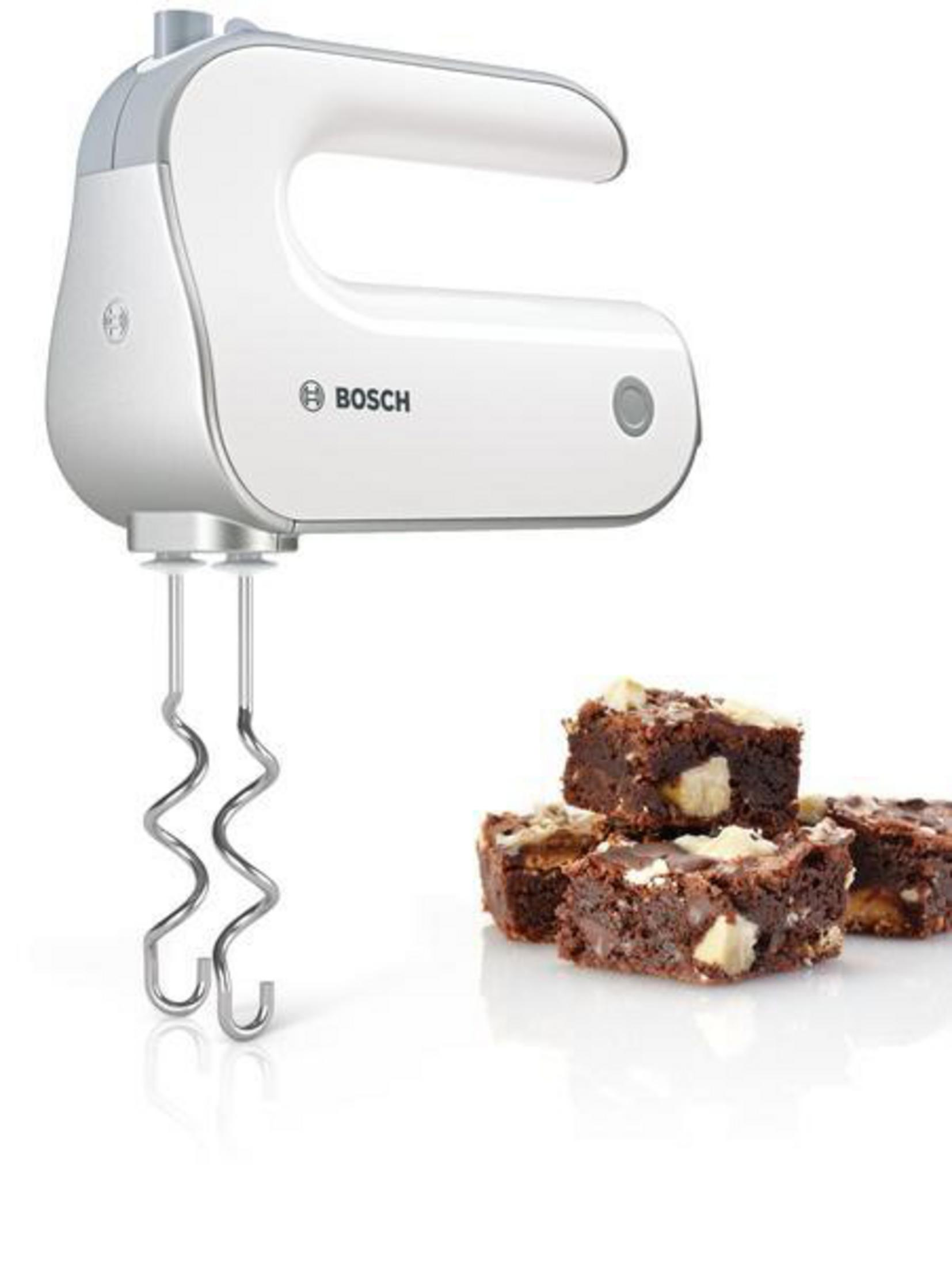 A white hand mixer with brownies. The mixer is above, and the brownies are below, on a white background.