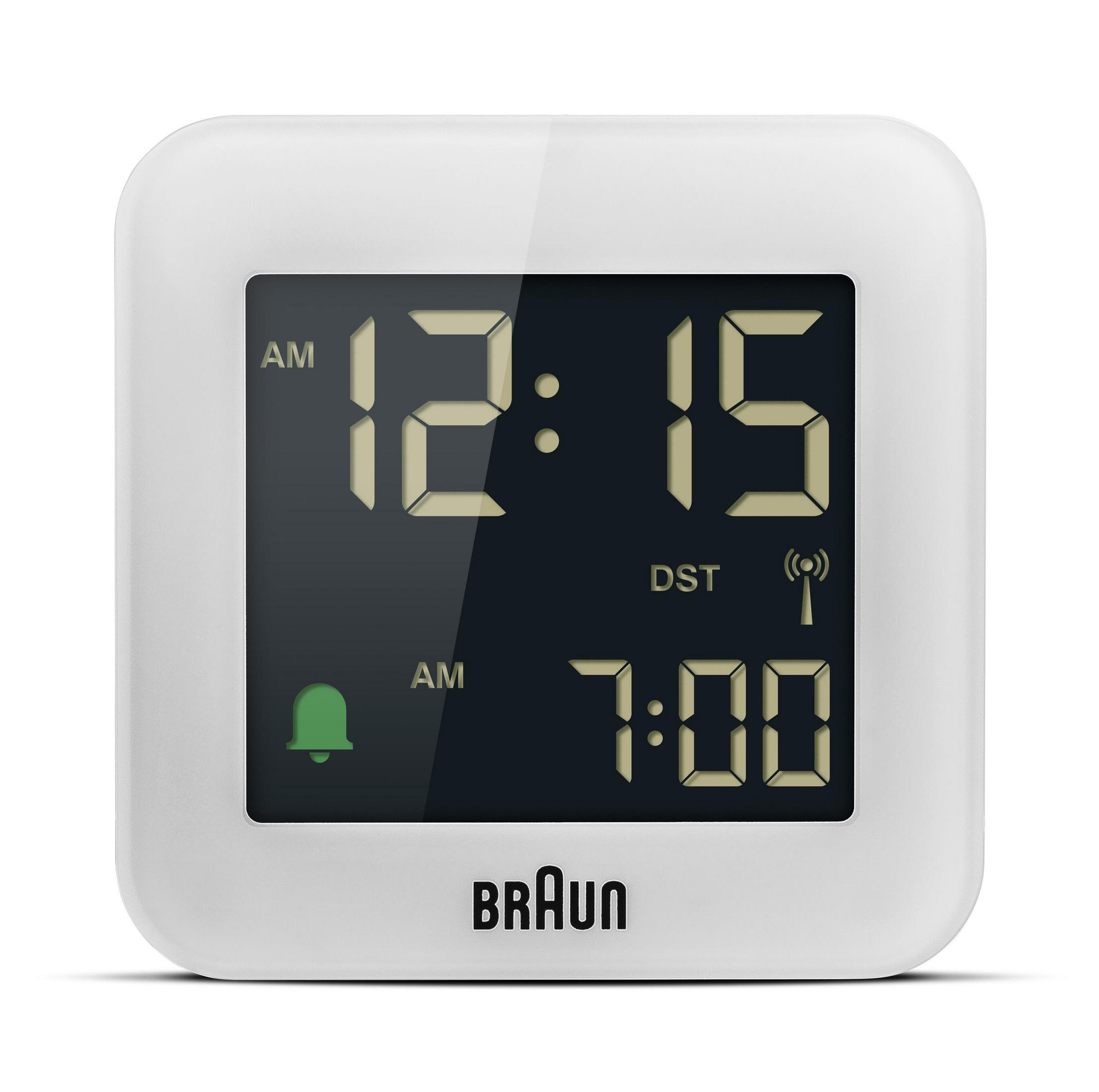 Ein weißer digitaler Wecker mit einer Anzeige von 12:15 Uhr und 7:00 Uhr.