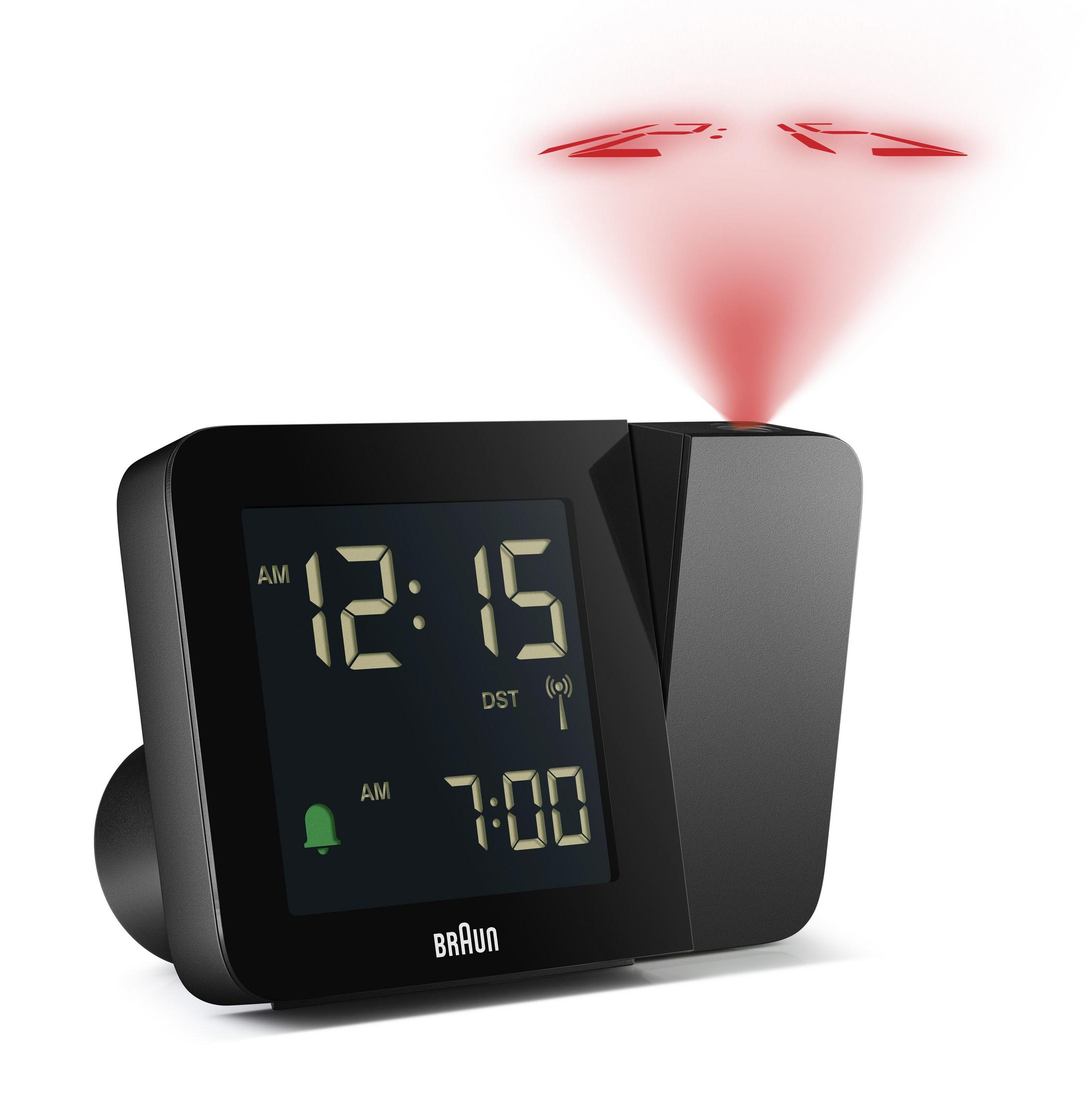 Ein schwarzer Braun-Wecker mit Zeitanzeige und roter Projektion. Die Uhr zeigt 12:15 Uhr und 7:00 Uhr.