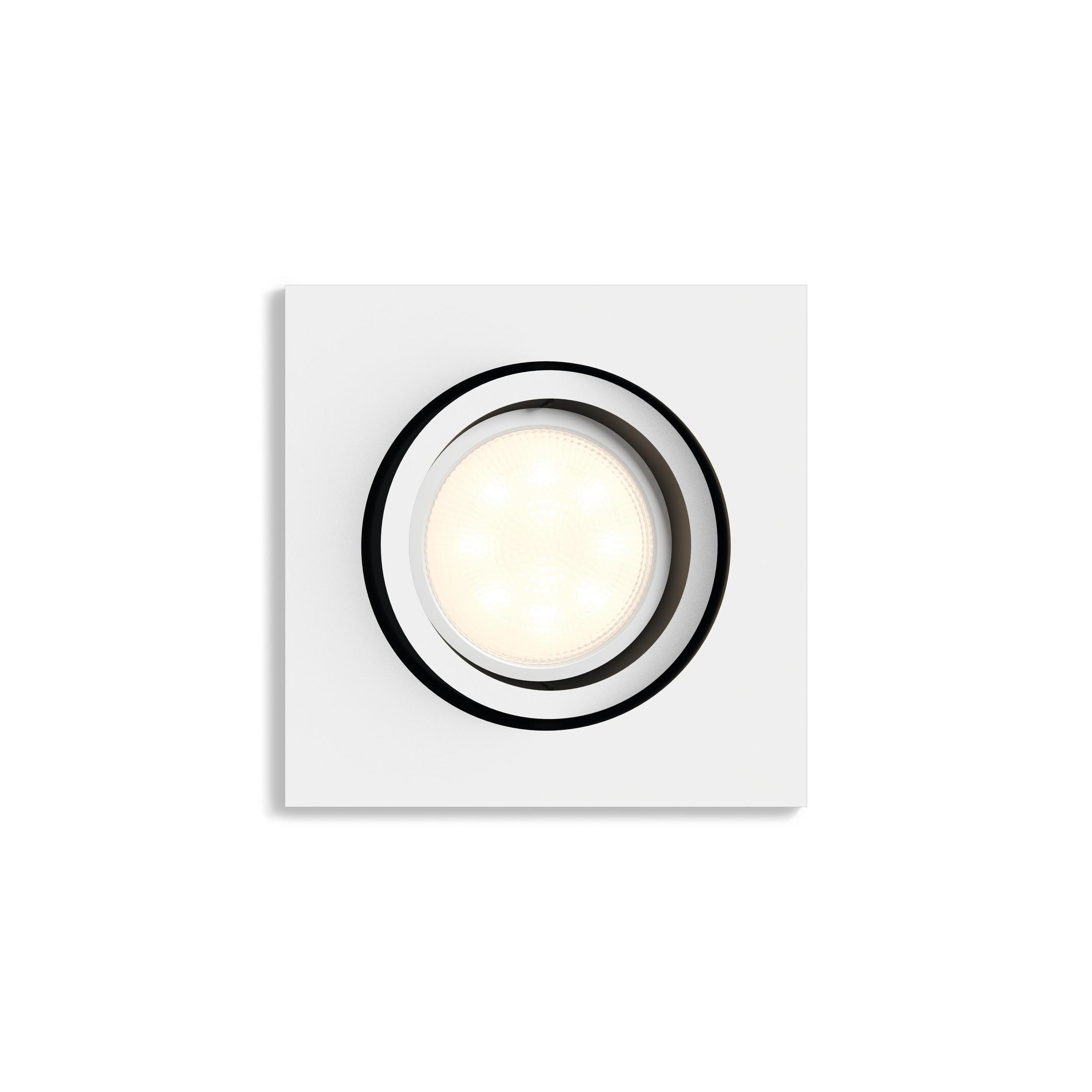Un encastré de plafond carré blanc avec un anneau noir et des lumières centrales.