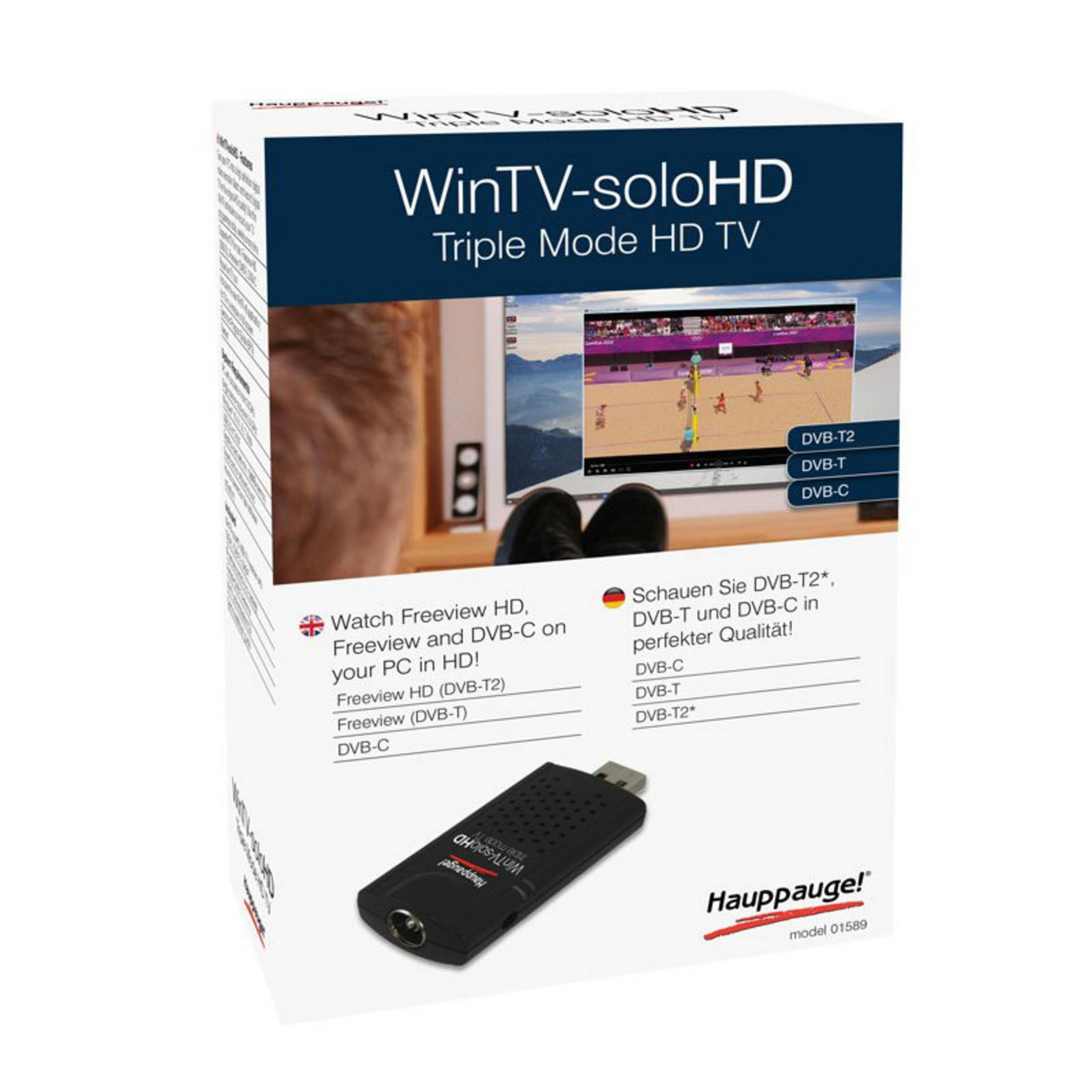 Eine Box mit TV-Tuner und ein Bild von Katze, Füßen und Fernsehbildschirm.