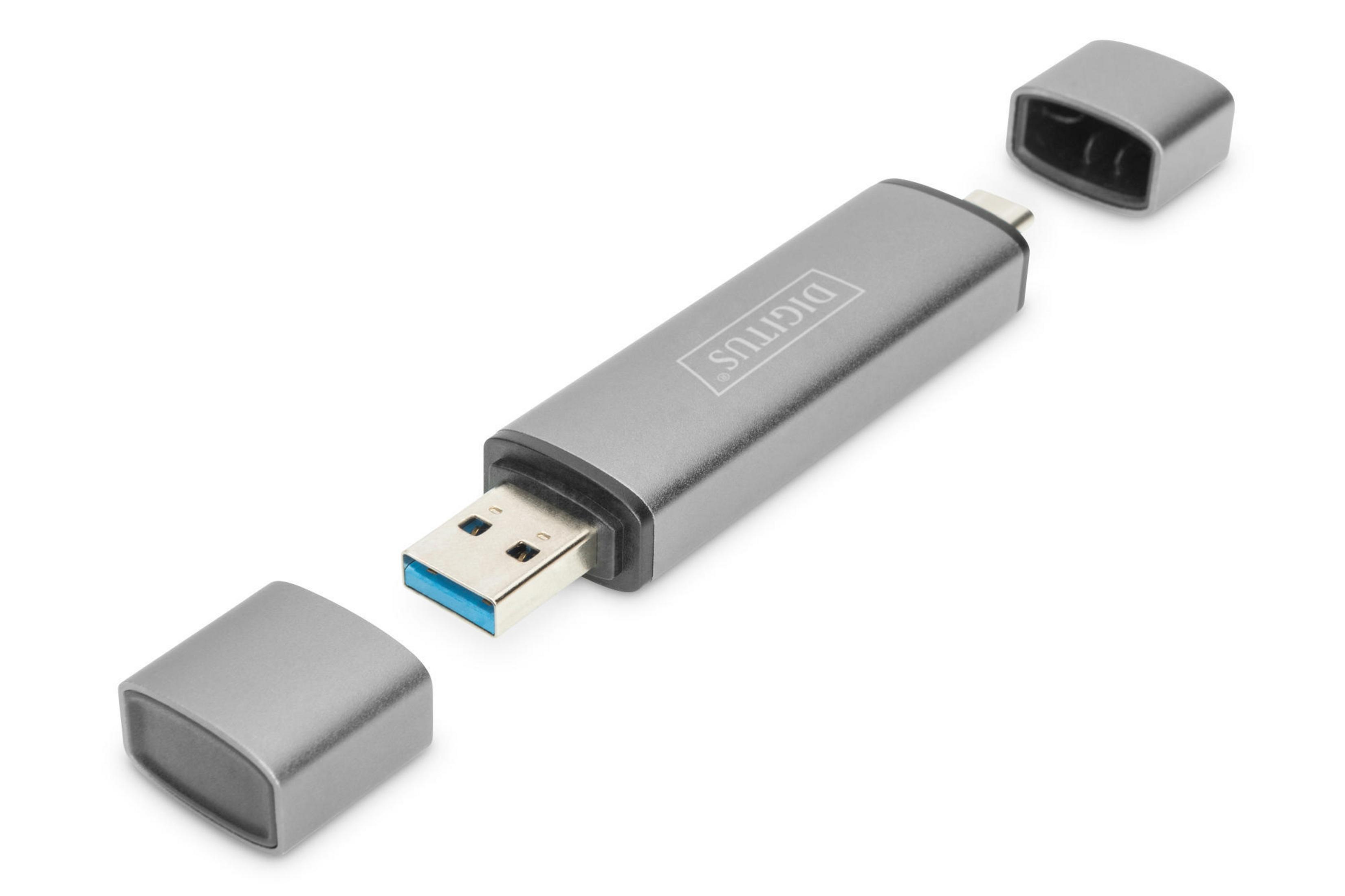 Silberner USB-Stick mit abgezogenen Kappen. Er liegt auf einer weißen Oberfläche.