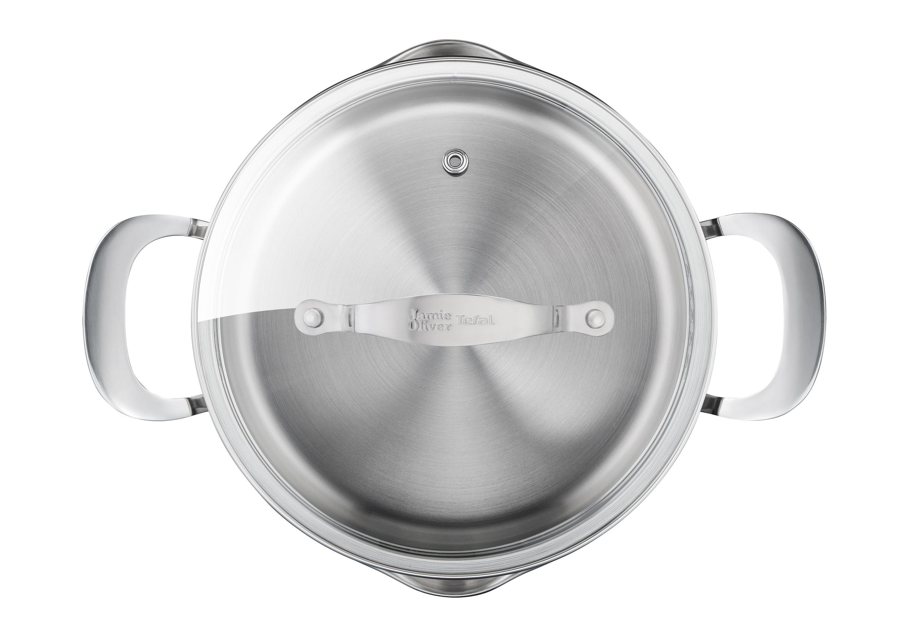 Une poêle en acier inoxydable, vue de dessus, montre un couvercle en verre. La poignée du couvercle porte la marque 'Jamie Oliver Tefal'.