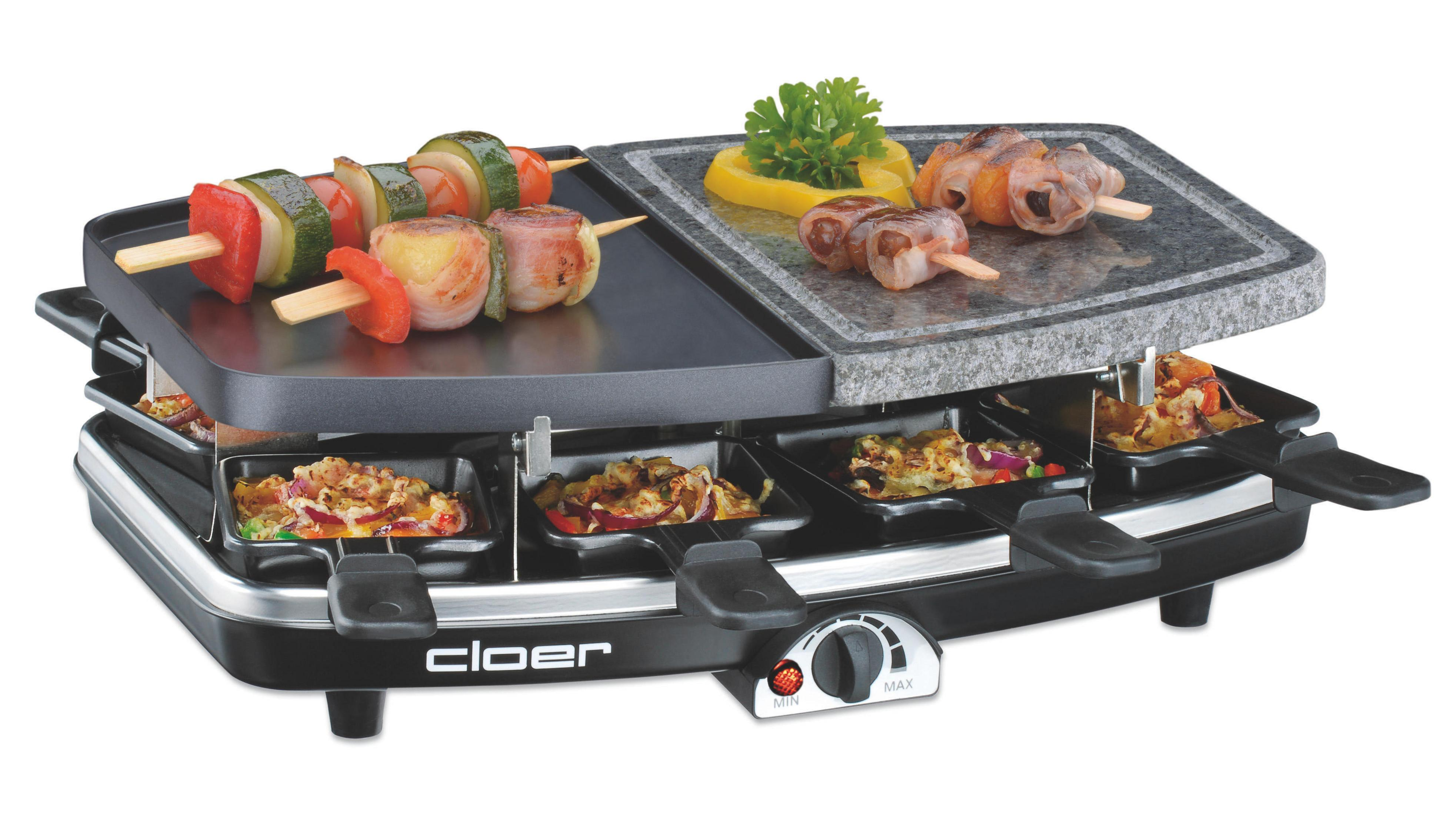 Raclette-Grill mit Essen. Enthält Spieße, gegrilltes Gemüse und Käse. Schwarz-Silber-Design.