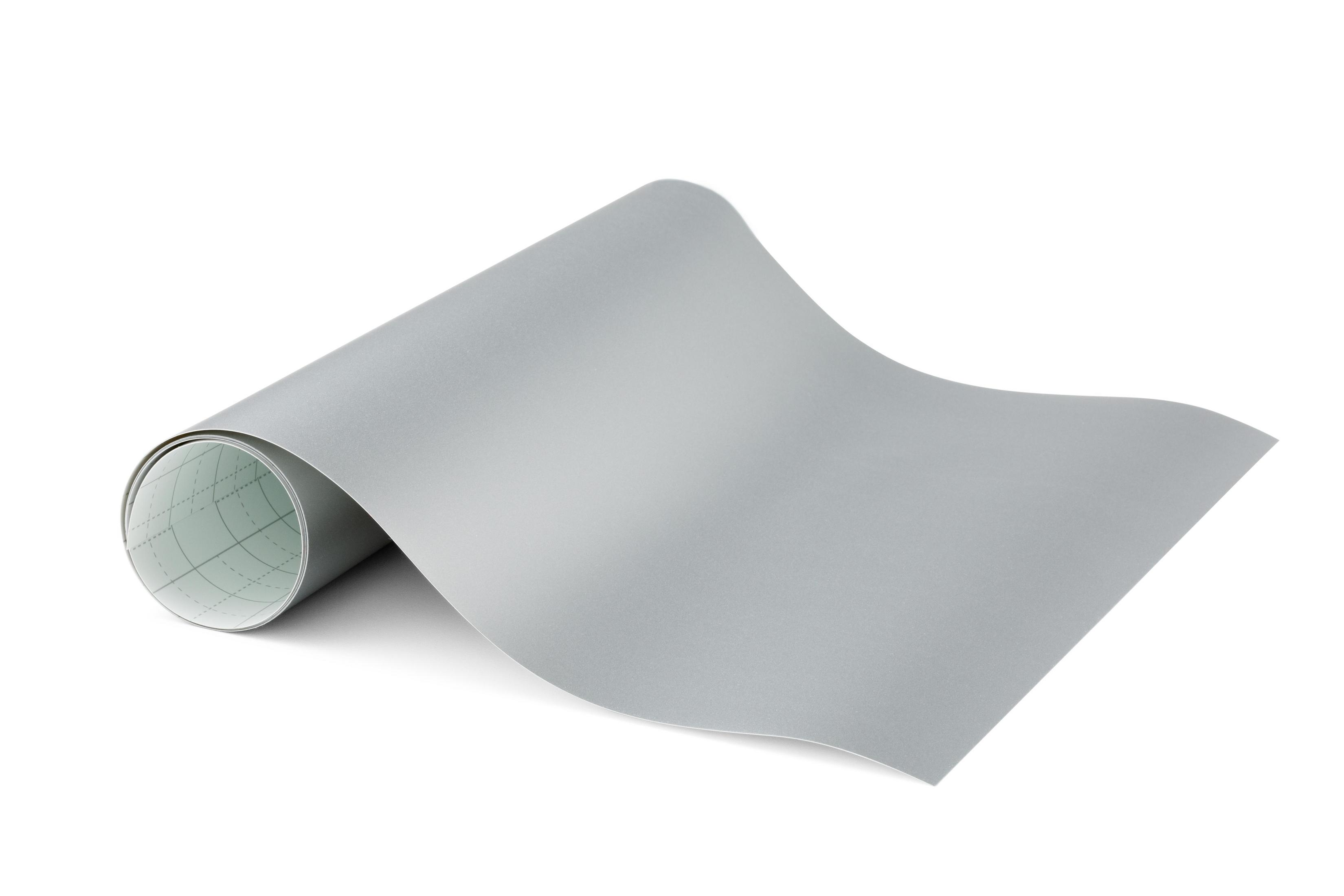 Gerolltes graues Papier. Das Papier ist teilweise ausgerollt, ein Rastermuster auf der Rückseite.