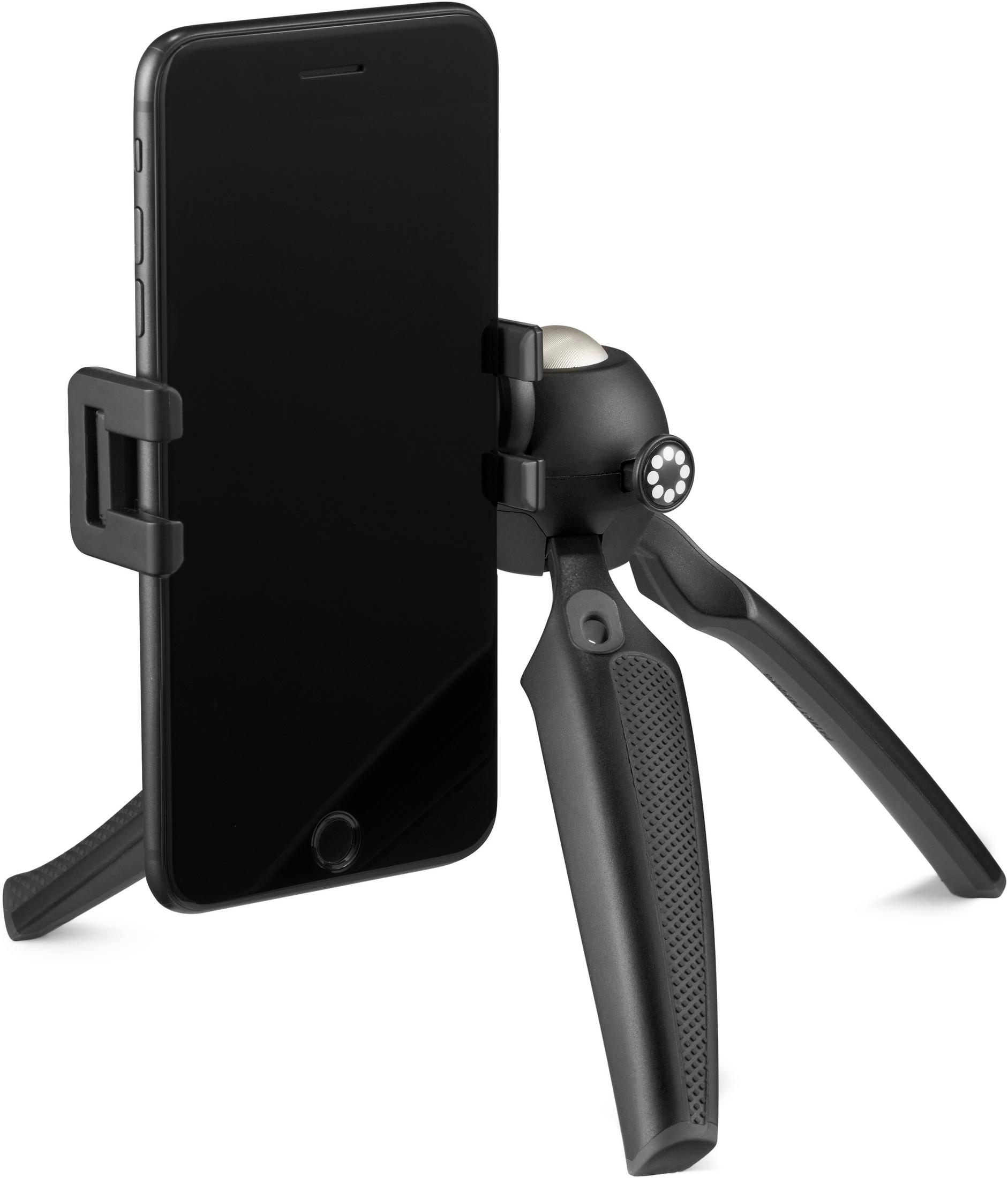 Schwarzes Smartphone auf einem kleinen Stativ, in einer Halterung gehalten.
