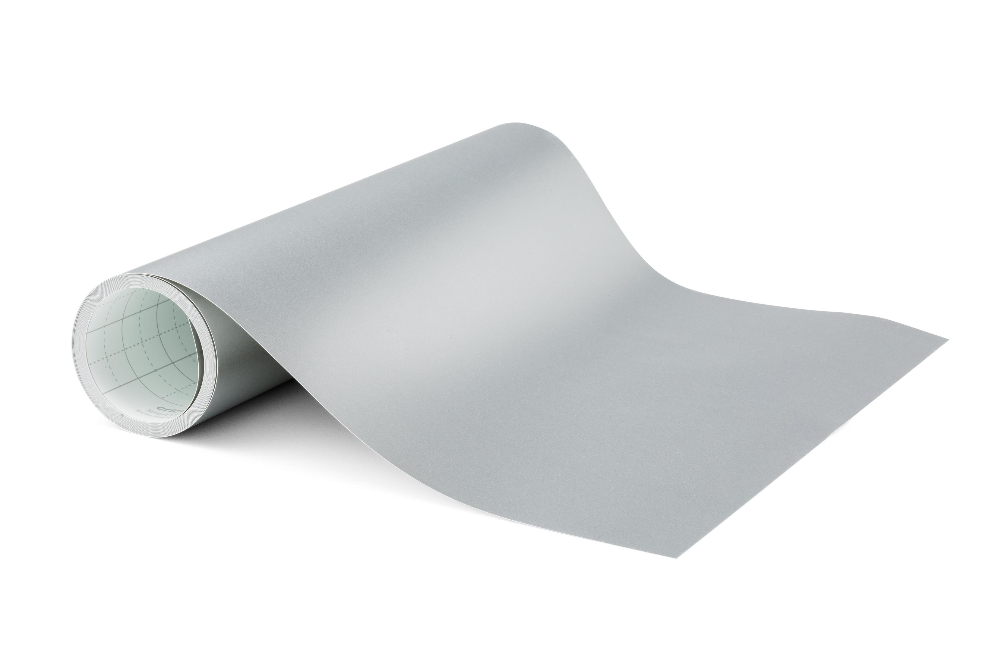 Eine Rolle graues Papier auf einer weißen Oberfläche.