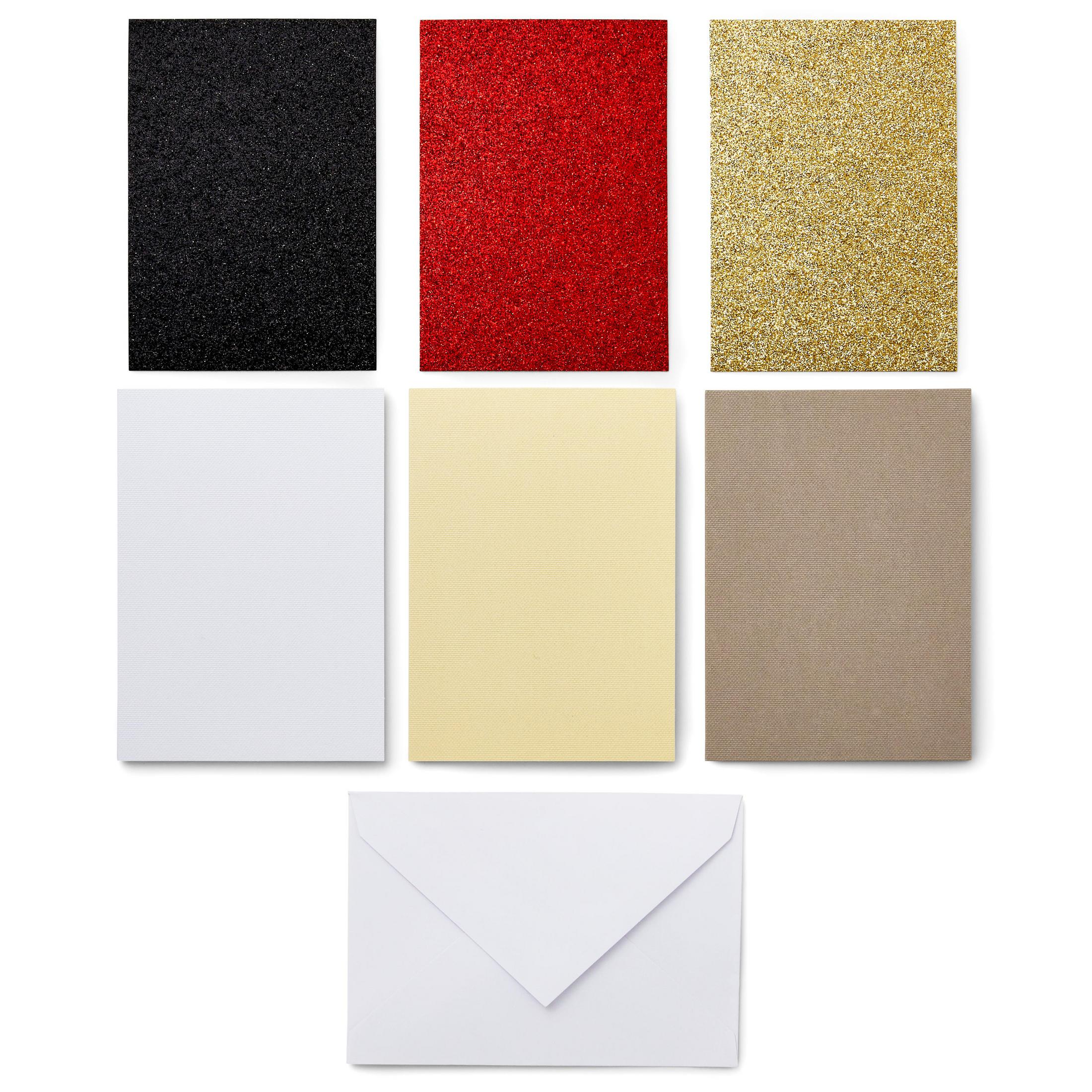 Sechs Blatt farbiges Papier. Schwarz, rot, Goldglitzer. Weiß, gelb und braun.