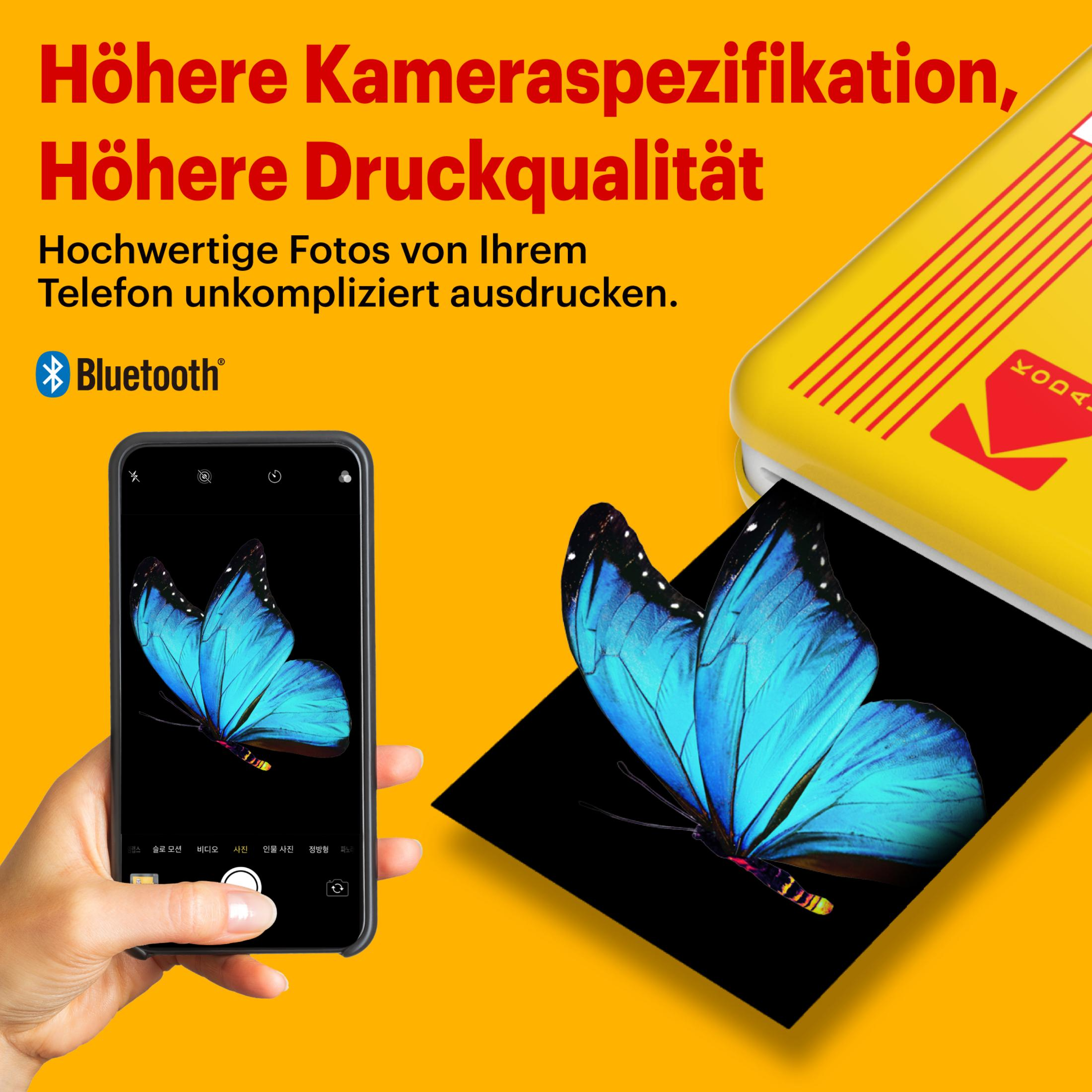 Ein Telefon zeigt einen blauen Schmetterling, mit Drucker und Text.