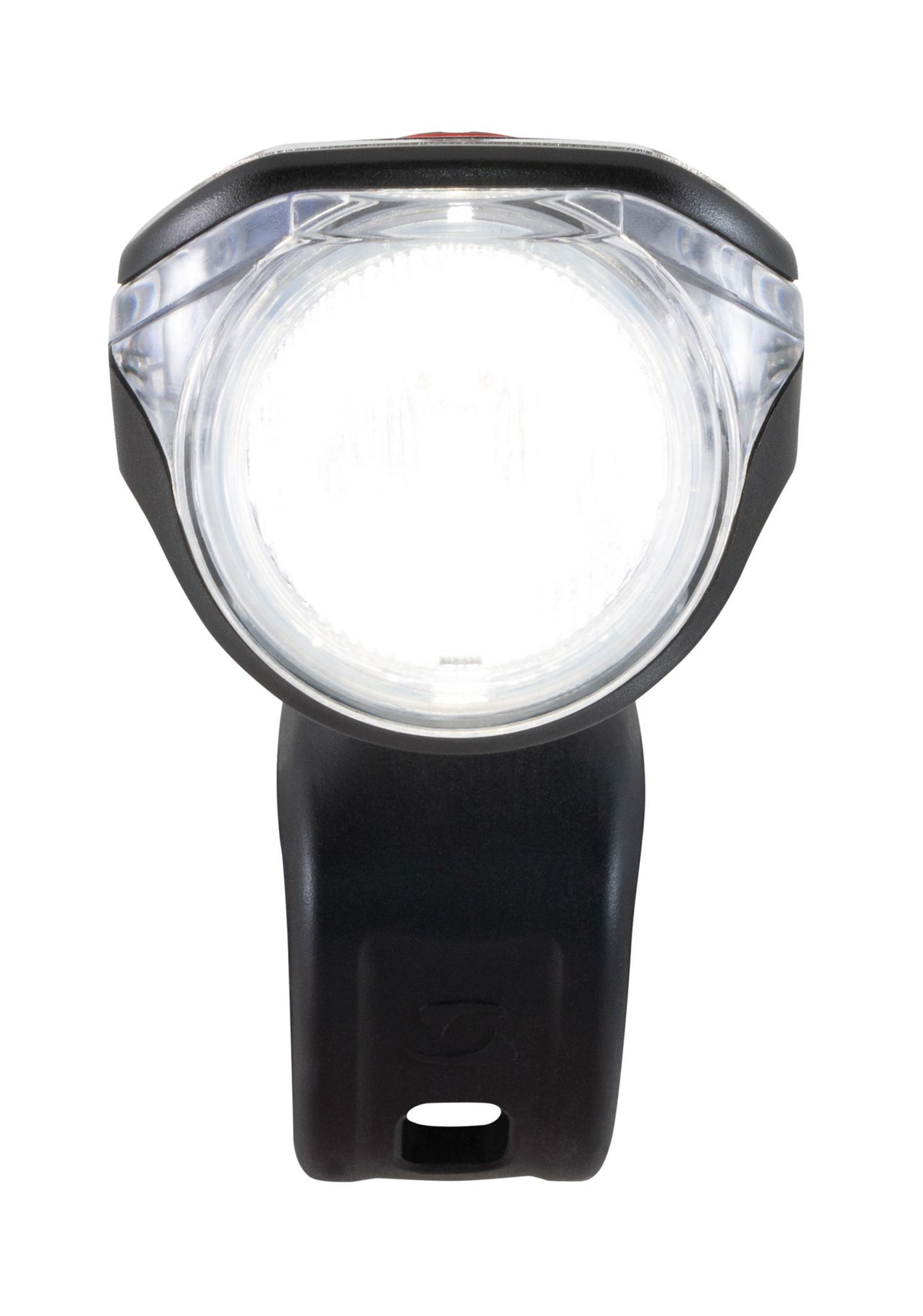 Czarna lampa rowerowa, jasne białe światło. Przezroczysta soczewka z wyraźnym okrągłym światłem.