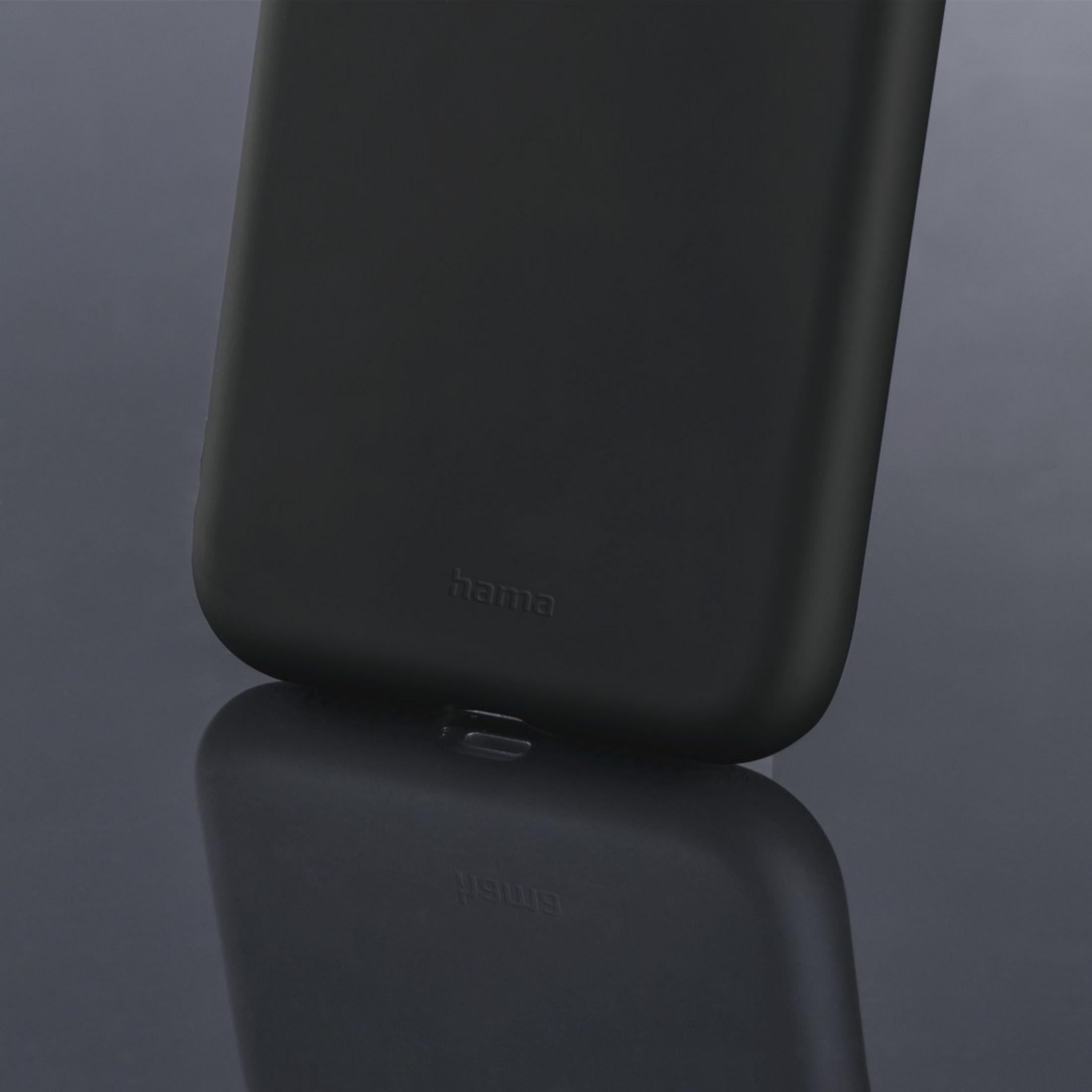 Custodia nera per telefono con logo 'hama' su superficie riflettente.