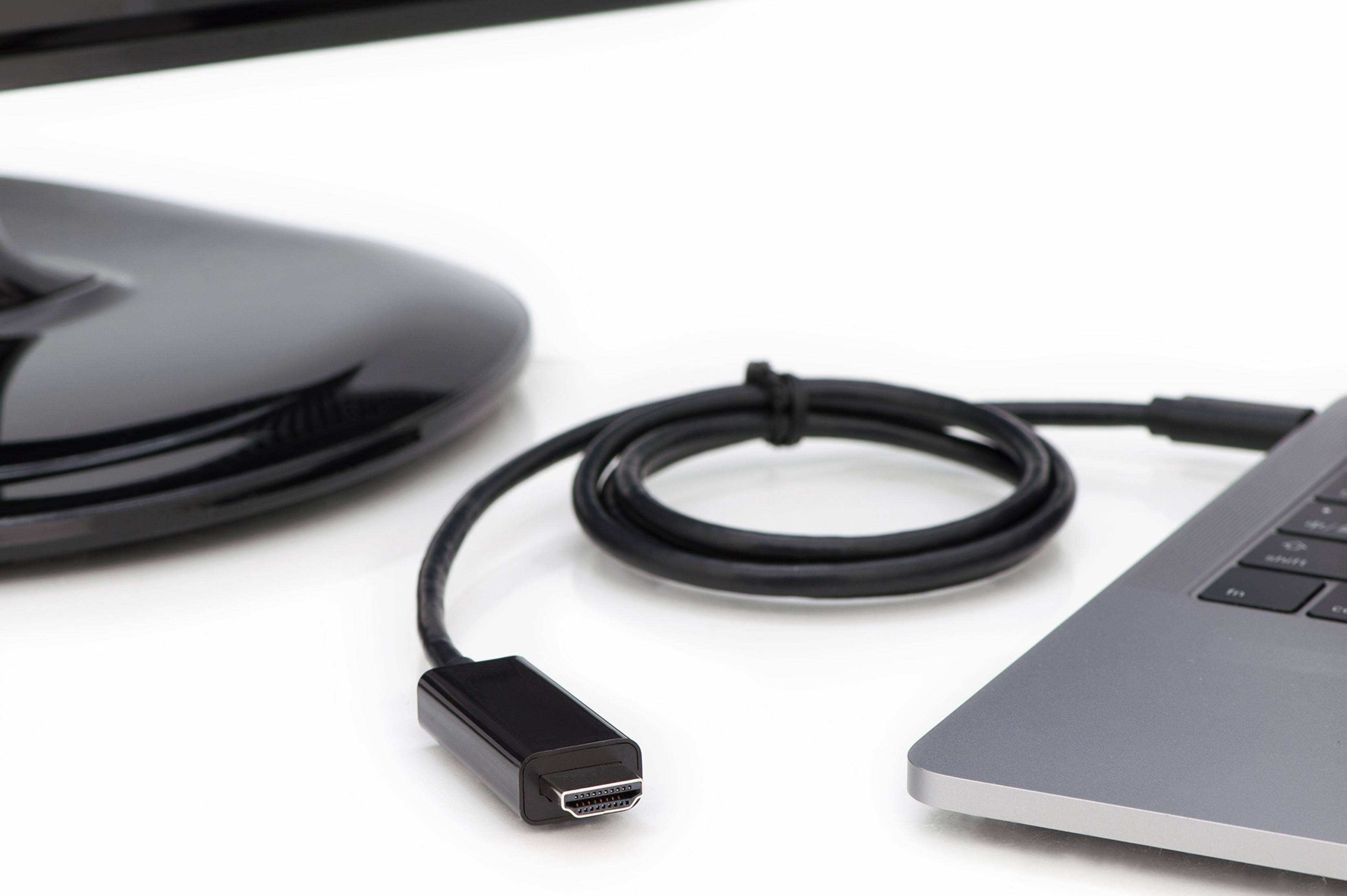 Schwarzes HDMI-Kabel, das mit Laptop und Monitor verbunden ist.