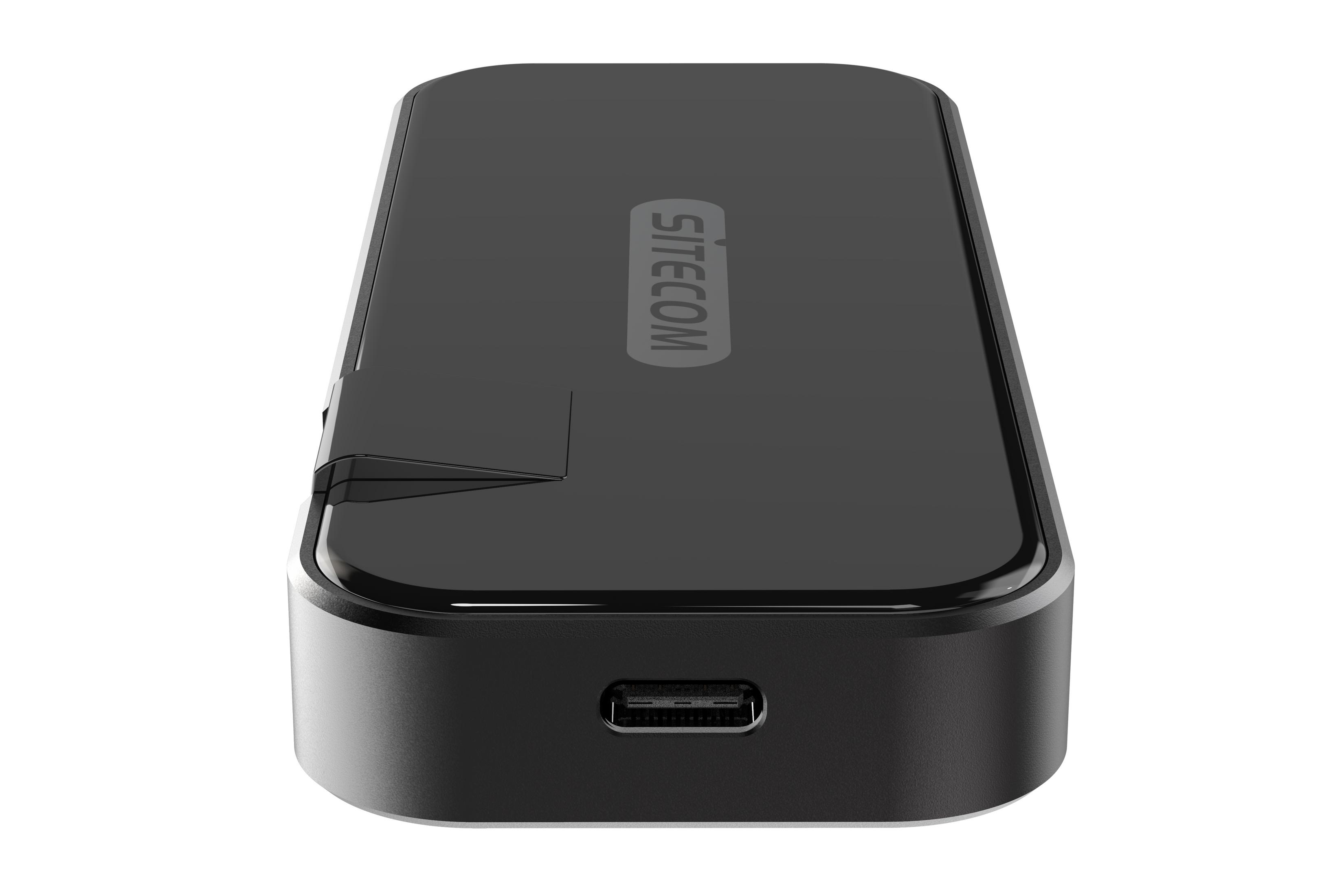 A black rectangular device with the SITECOM logo, featuring a USB port, set against a white background.