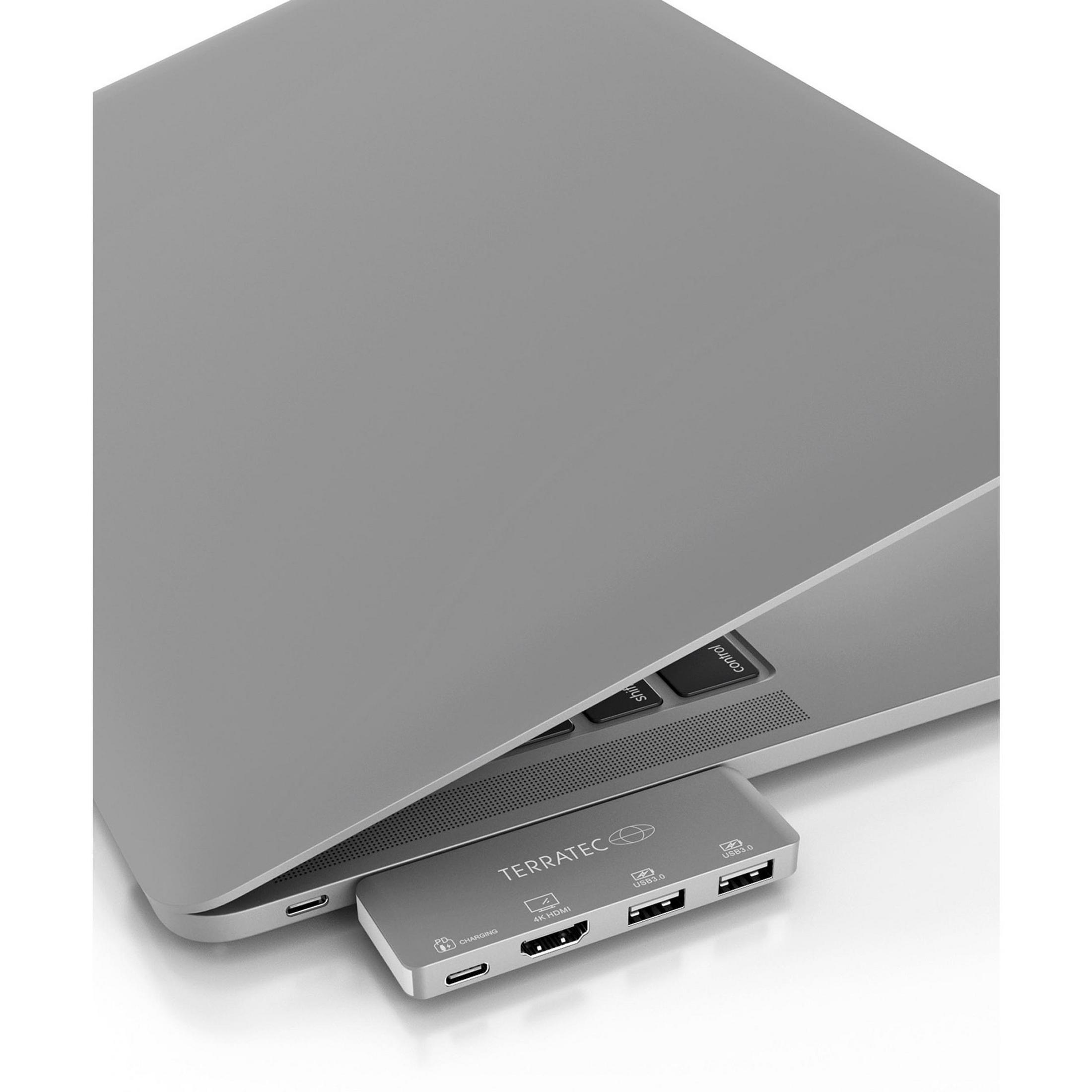 Ein silberner Laptop mit angeschlossenem grauem TERRATEC USB-Hub. Der Hub hat mehrere Anschlüsse.