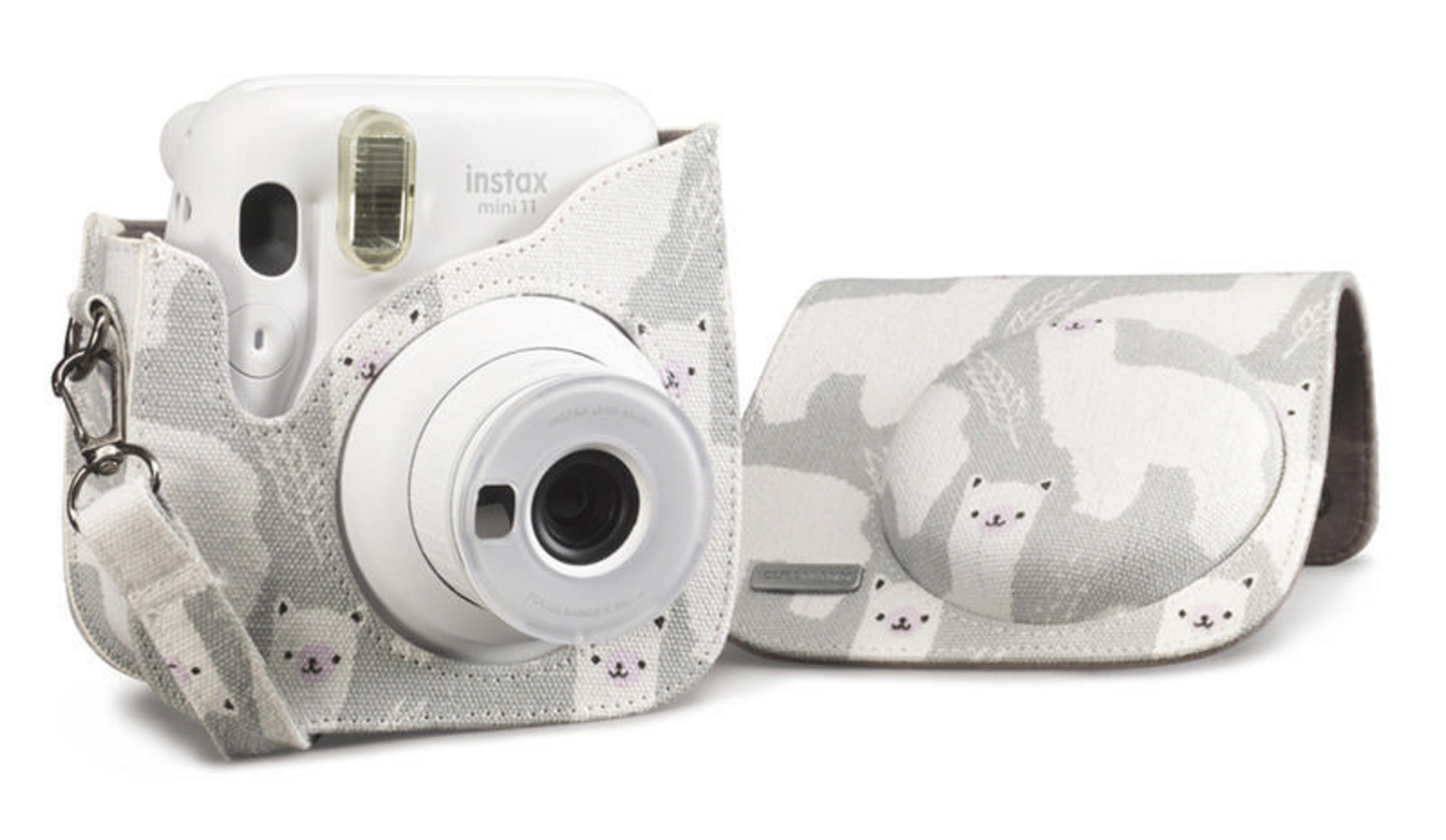 White Instax Mini 11 camera with a case. The case has a bear pattern on a gray background.