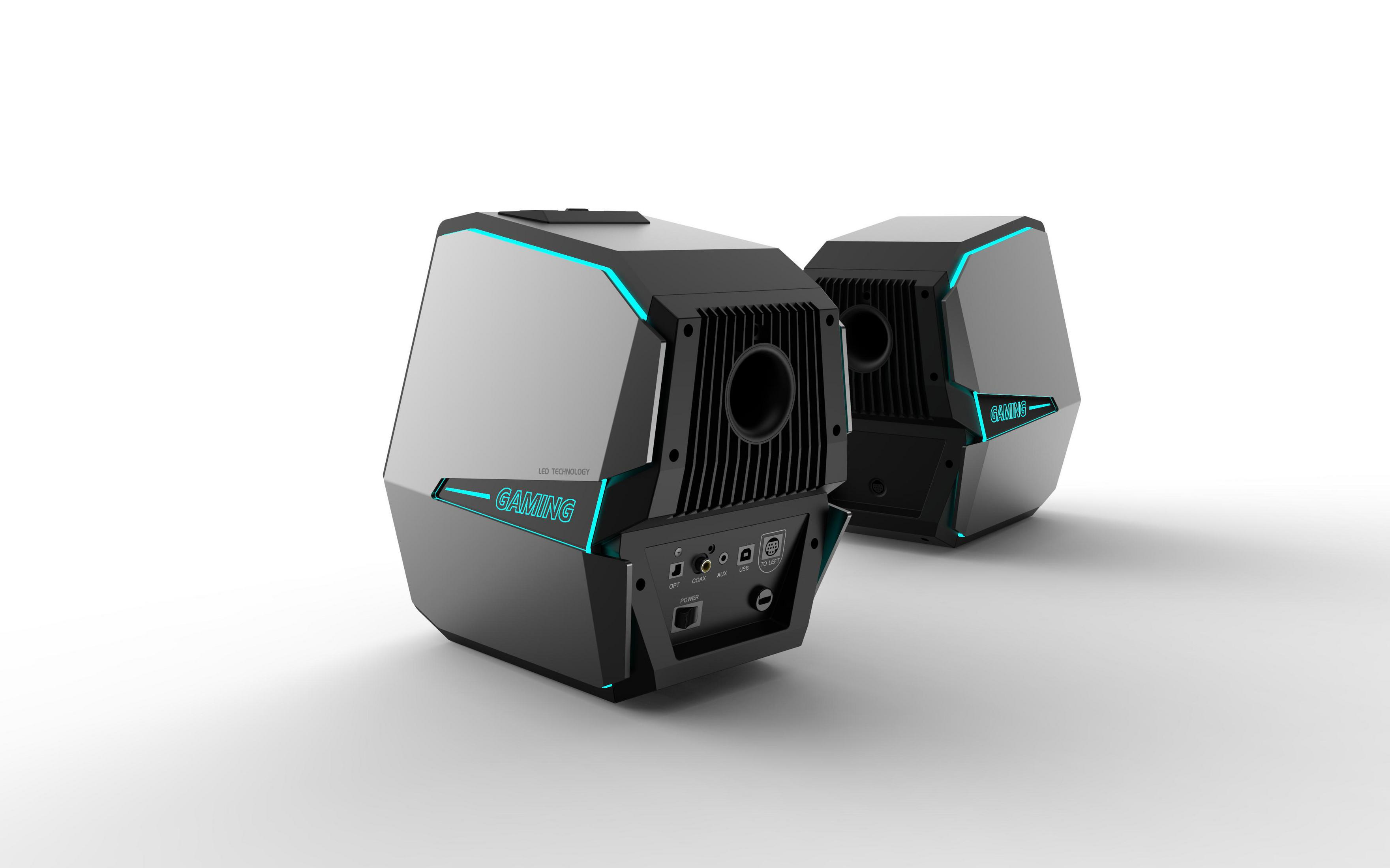 Due altoparlanti gaming neri con dettagli blu. Sono angolati verso lo spettatore.