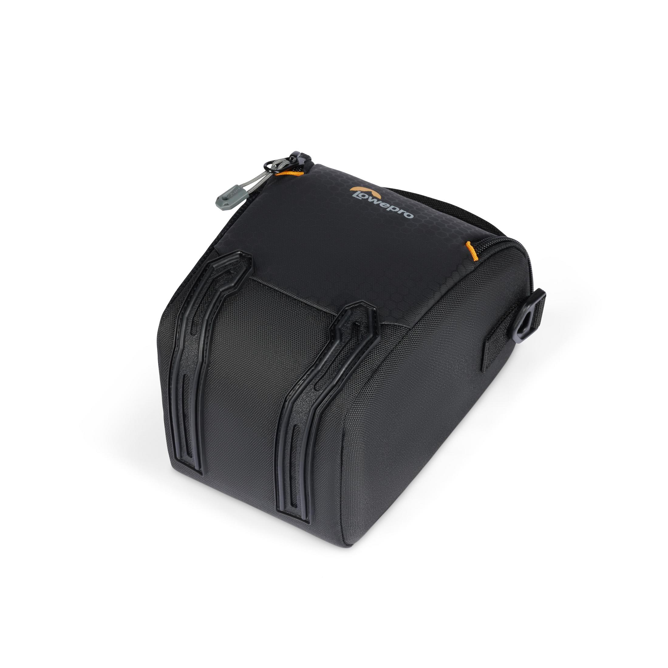 Black and grey camera bag. The bag has a zipper, a handle, and a logo.