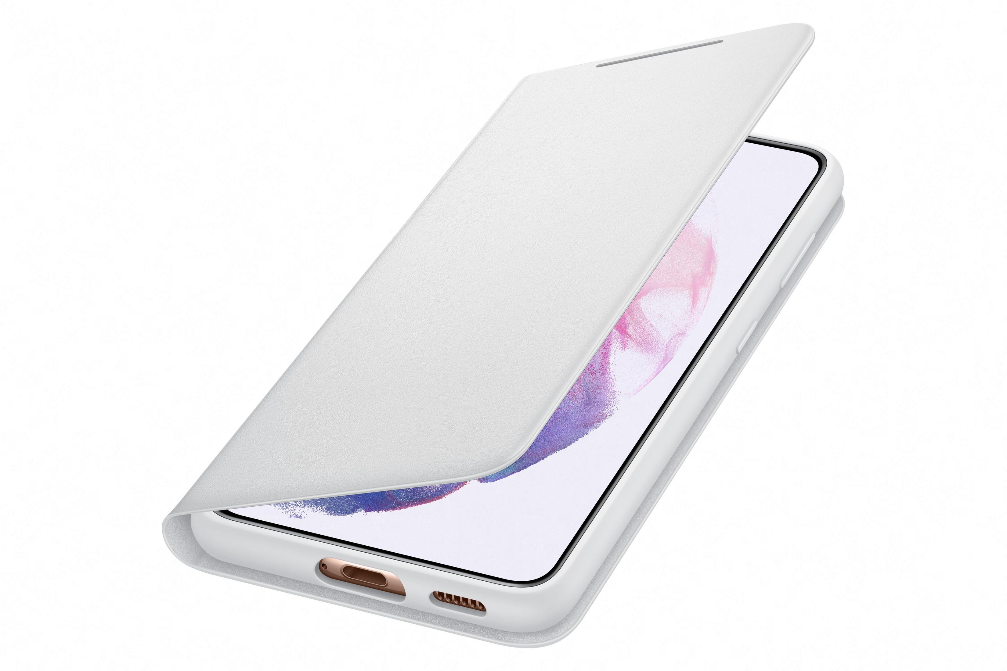 Una funda blanca para teléfono con un teléfono blanco dentro. La funda está abierta. El teléfono tiene una pantalla rosa.