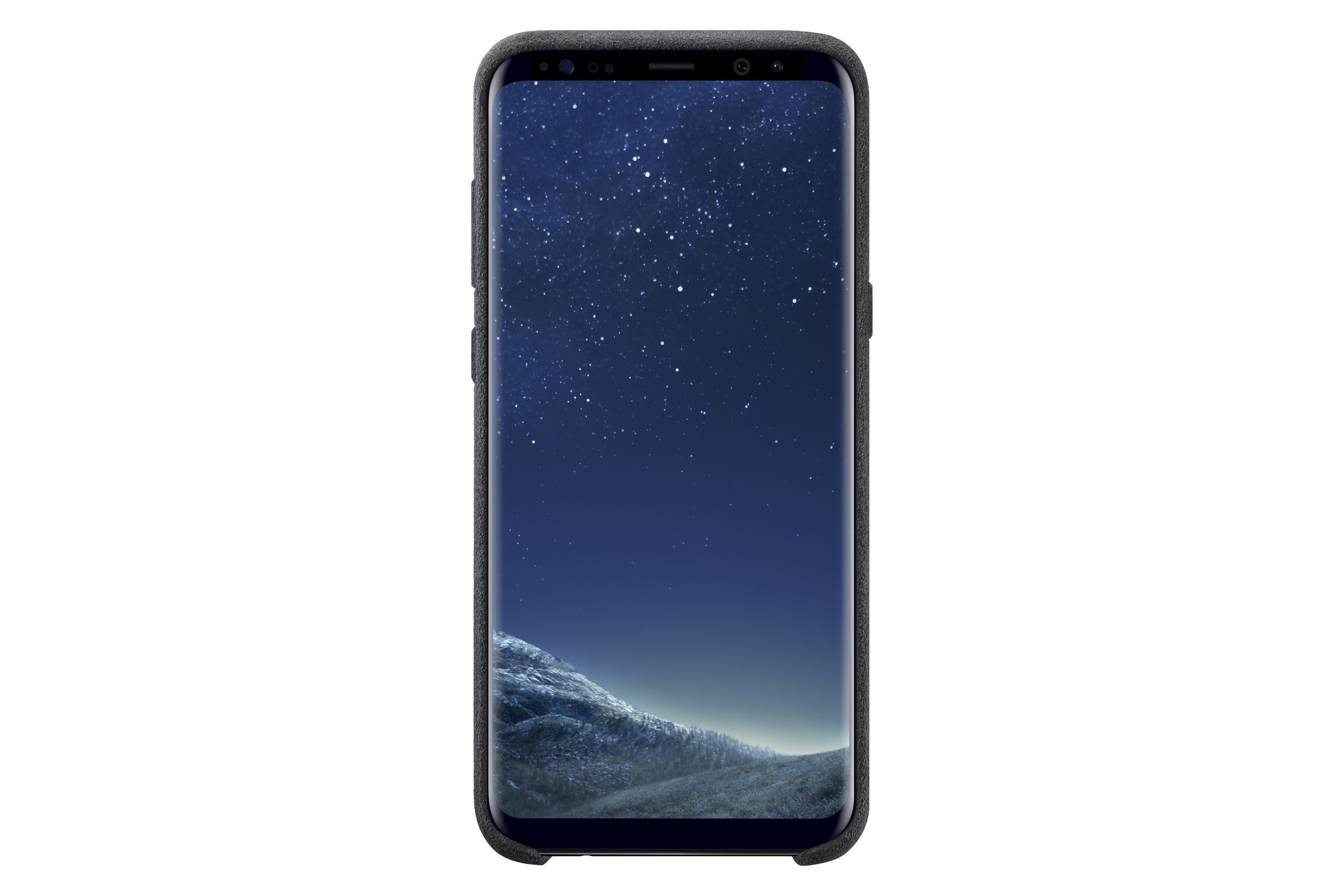 Smartphone nero con cielo stellato sullo schermo, isolato su bianco.