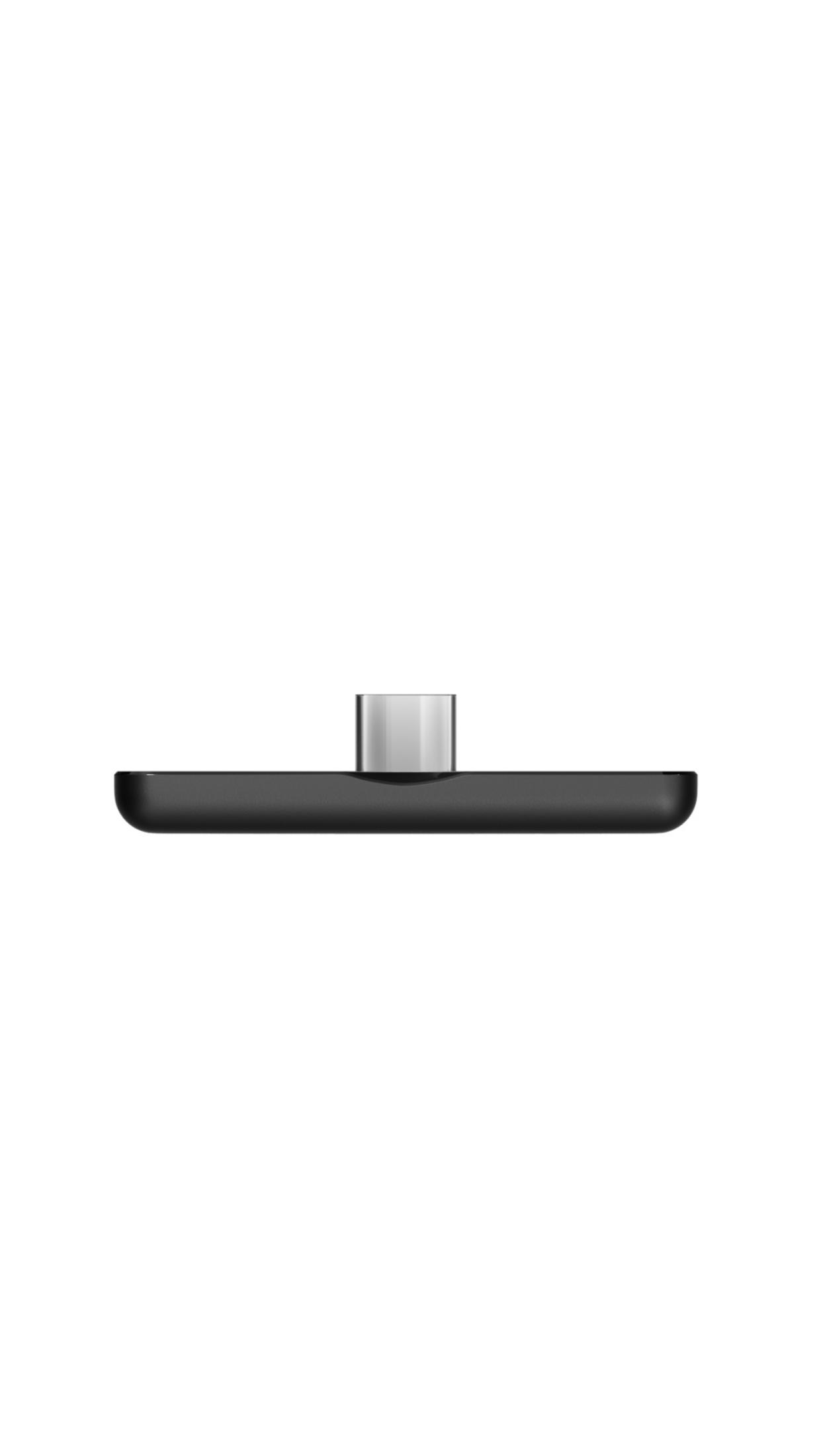 Eine schwarze Ladestation mit einem silbernen USB-C-Anschluss oben. Die Basis befindet sich auf einer weißen Oberfläche.