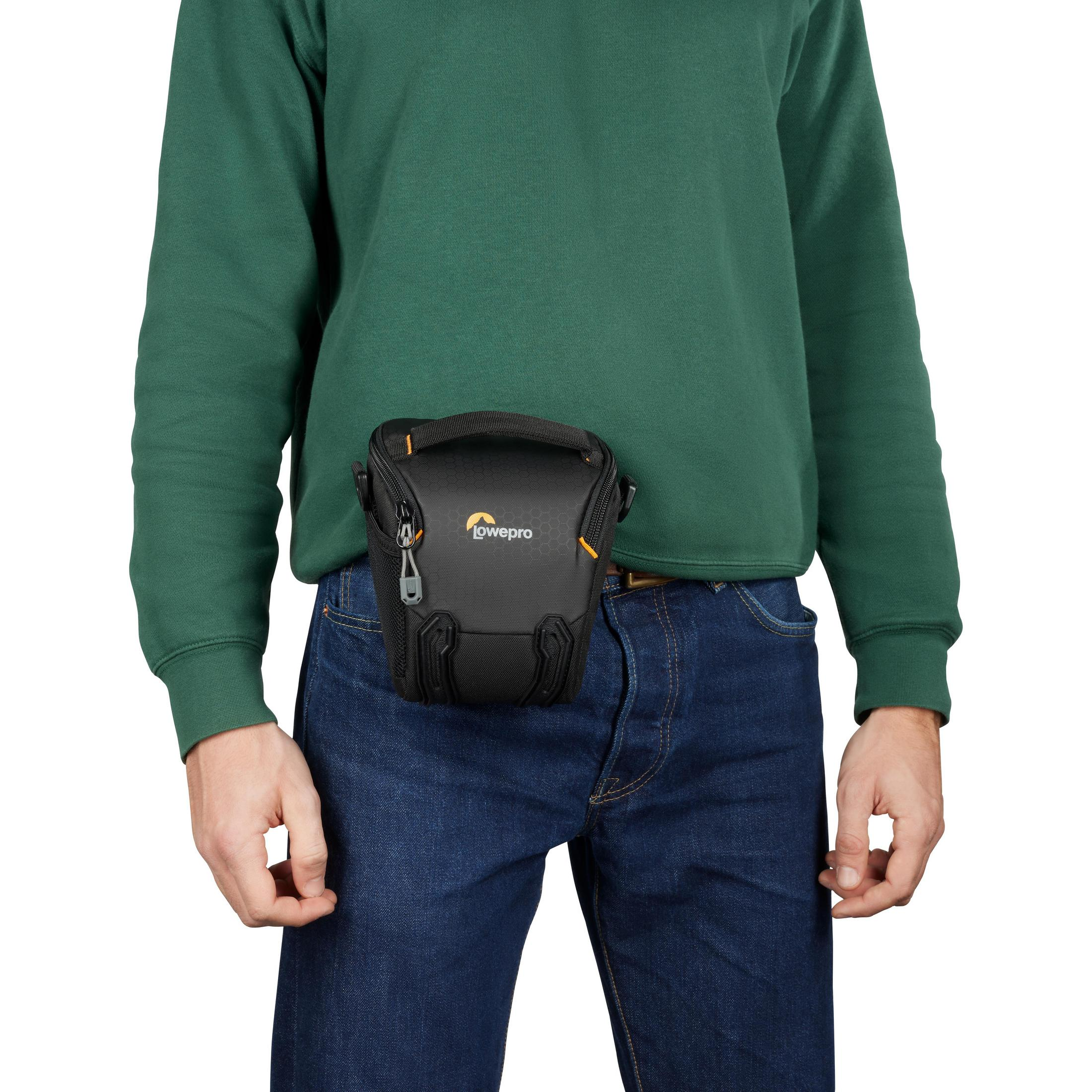 Person with a black camera bag around their waist.