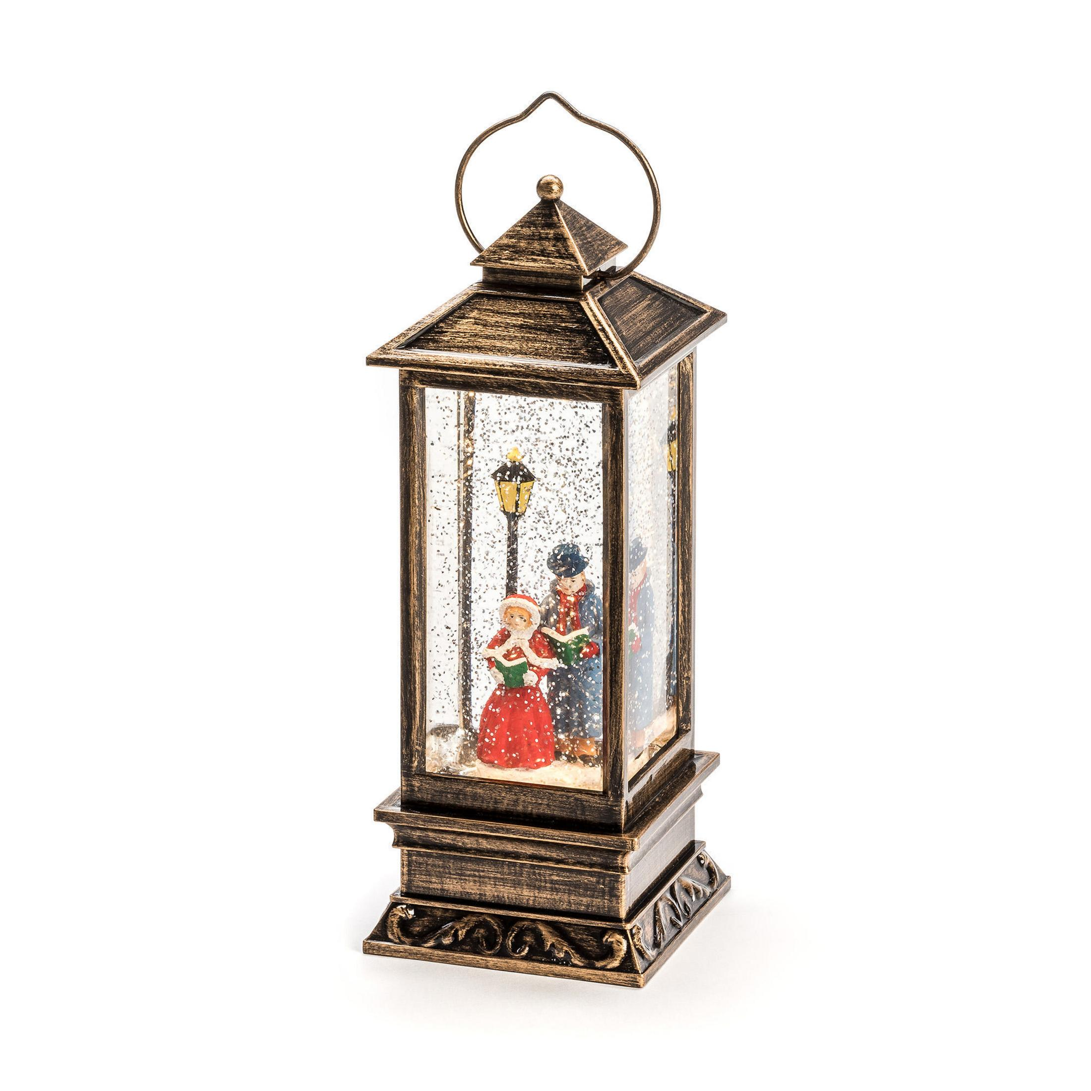 Dekorative Laterne mit Weihnachtsszene. Figuren, Schnee und Lichter. Verziertes Design. Weißer Hintergrund.
