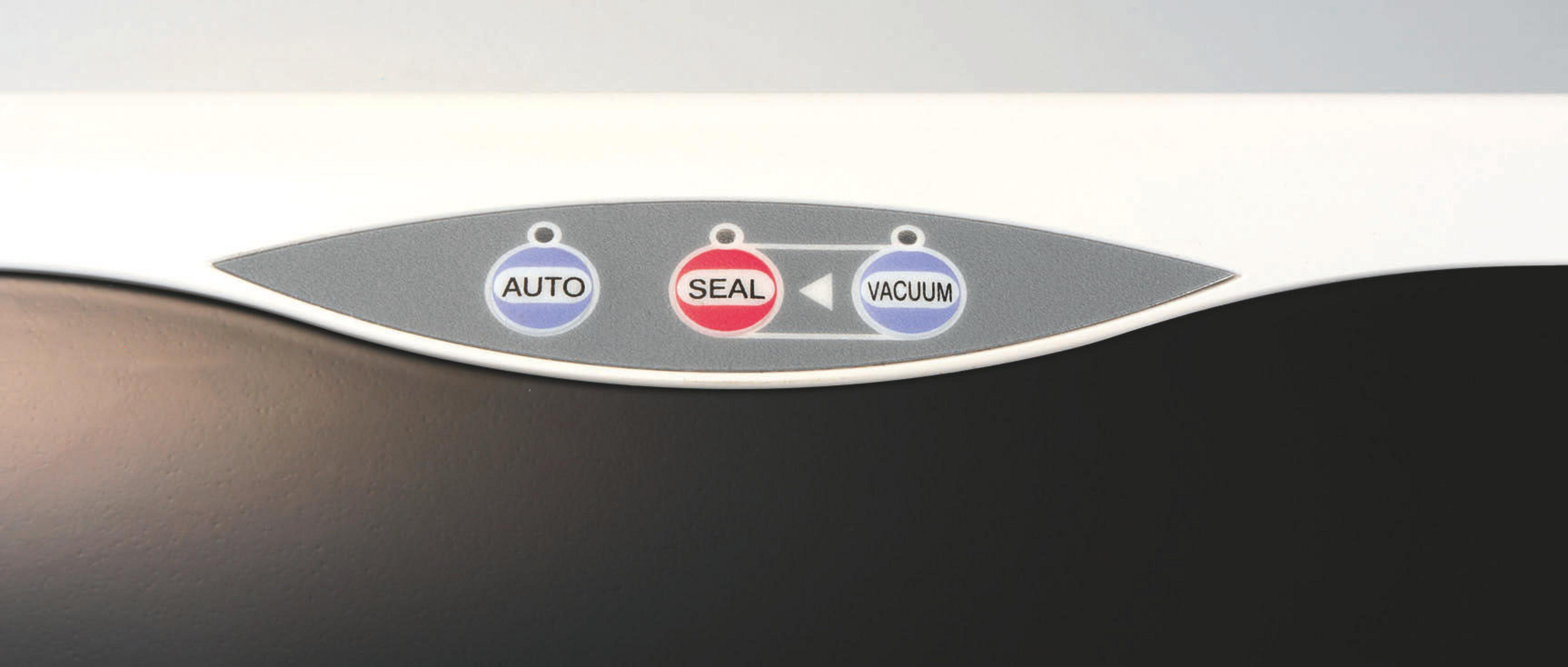 Zbliżenie białego urządzenia z przyciskami 'AUTO', 'SEAL' i 'VACUUM'.