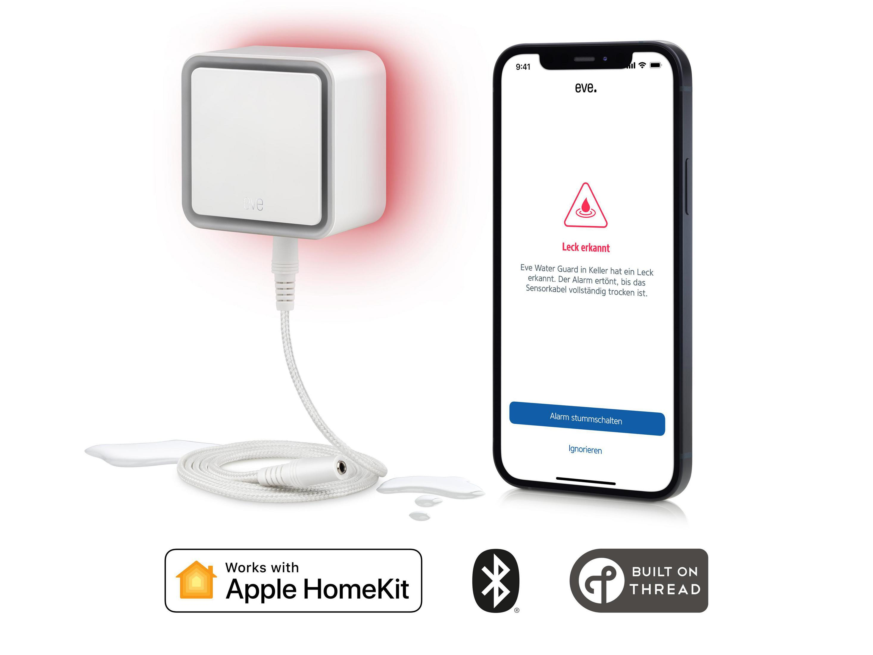 Un dispositivo cuadrado blanco con luz roja, conectado a un teléfono blanco. El teléfono muestra una advertencia.