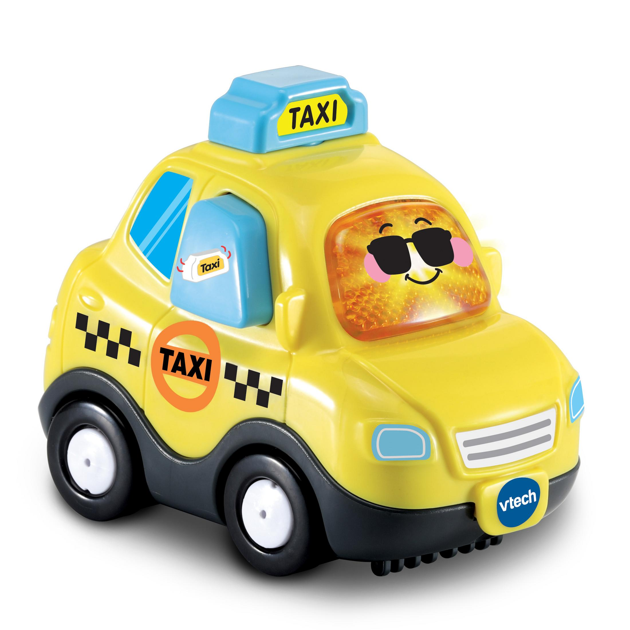 Gelbes Spielzeugtaxi mit blauem Dach, schwarz-weiß karierten Markierungen und einem lächelnden Gesicht.